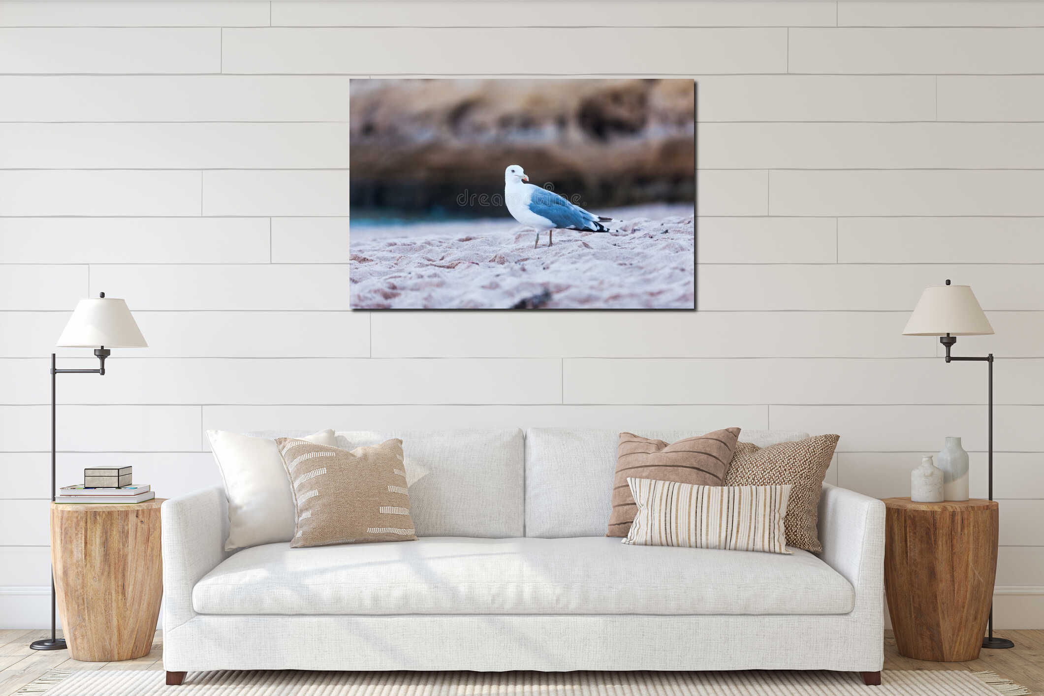Soft focus of a seagull on a sandy shore with a blurry background interior mockup