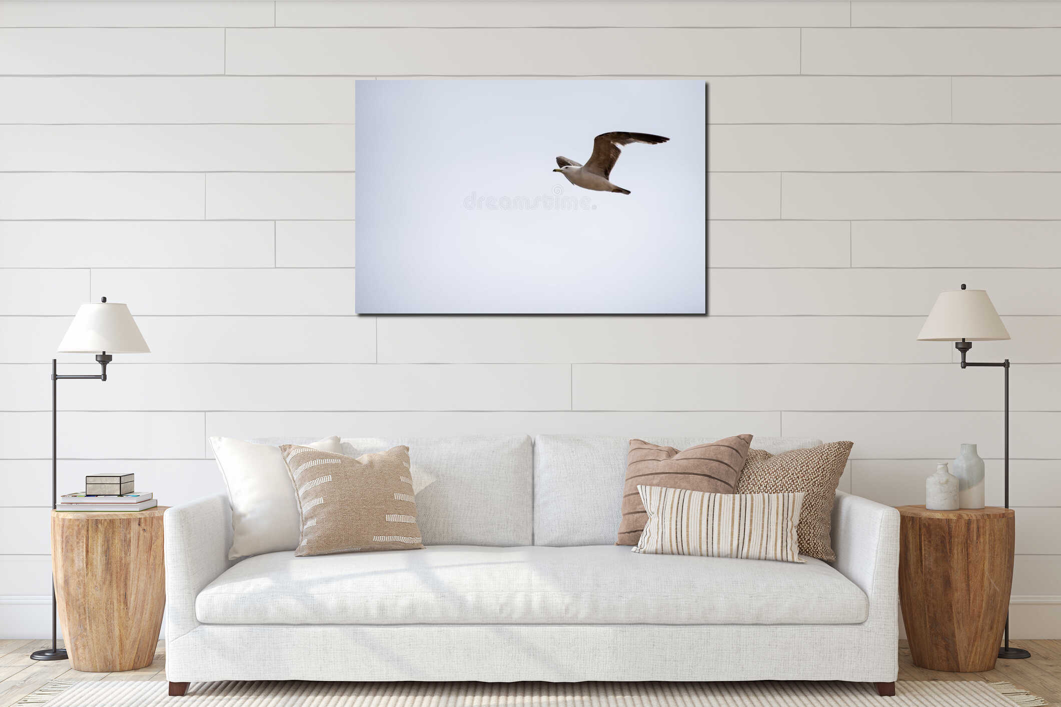 Single seagull flying in a sky as a background interior mockup