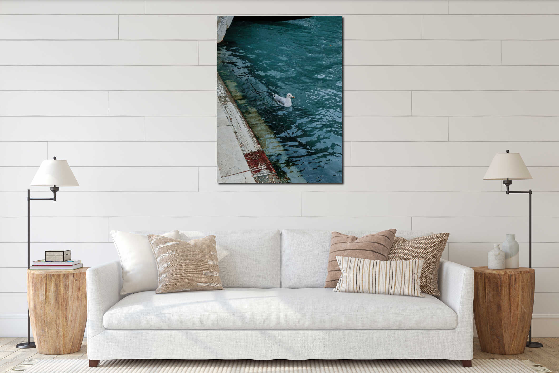 Vertical shot of a white seagull swimming in a pond interior mockup