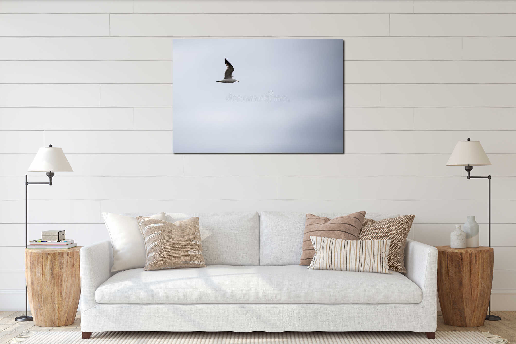Single seagull flying in a sky as a background interior mockup