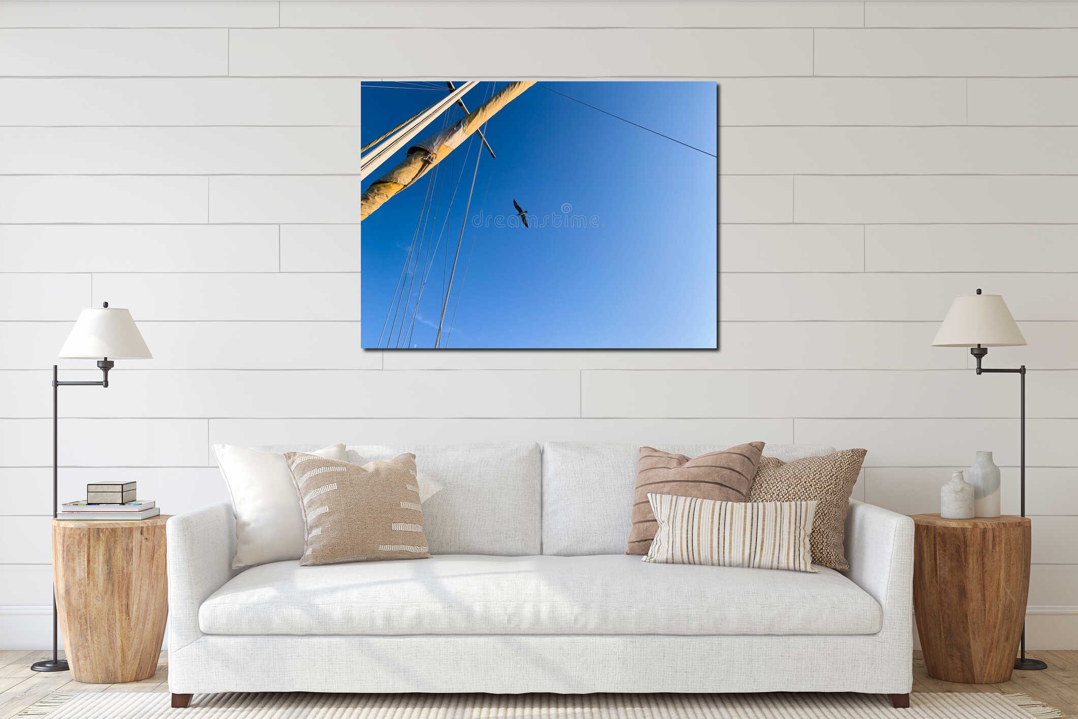 Upright view of rigging mast and ropes of a boat under blue sky with seagull interior mockup