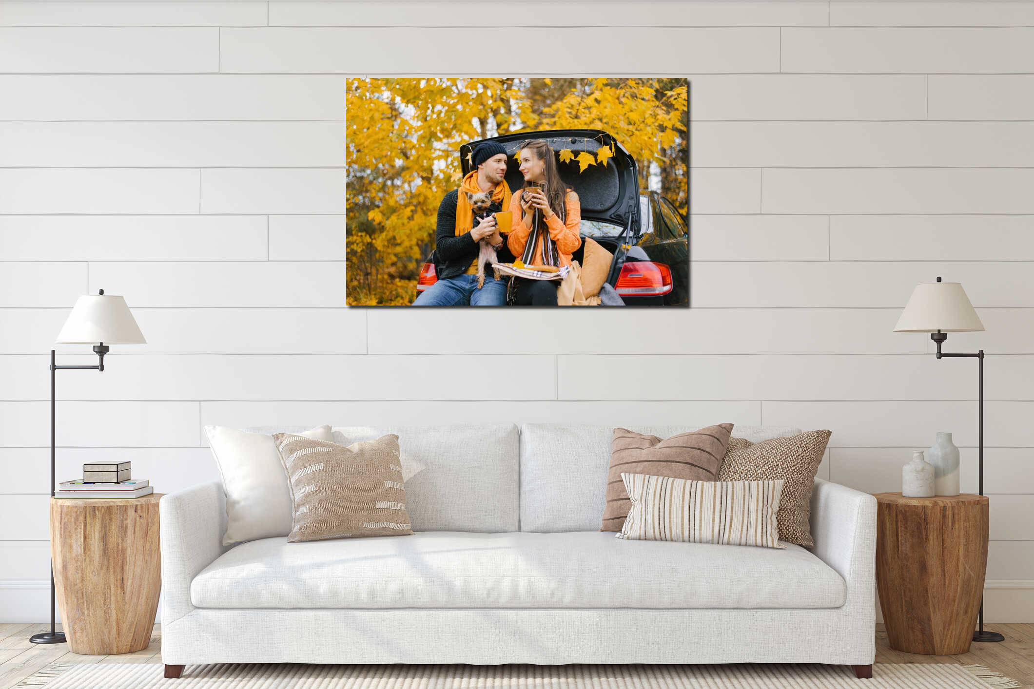 A happy young family is relaxing after a day spent outdoors in the autumn forest. A couple in love is sitting in the trunk of a interior mockup