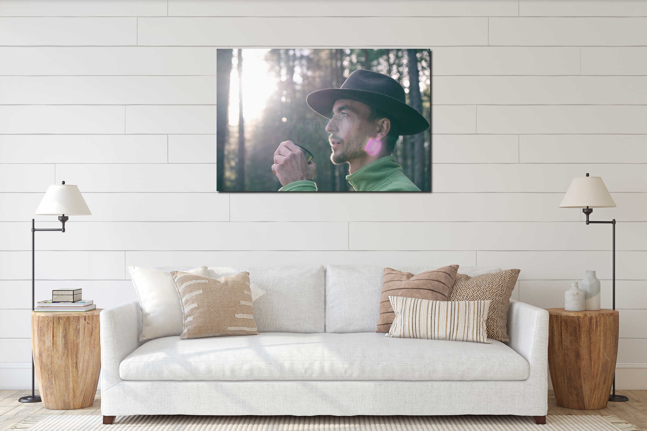 Portrait of bearded millennial man in felt hat drinking hot tea in woods on sunset. Tourist adventurer on trail in forest. Local interior mockup