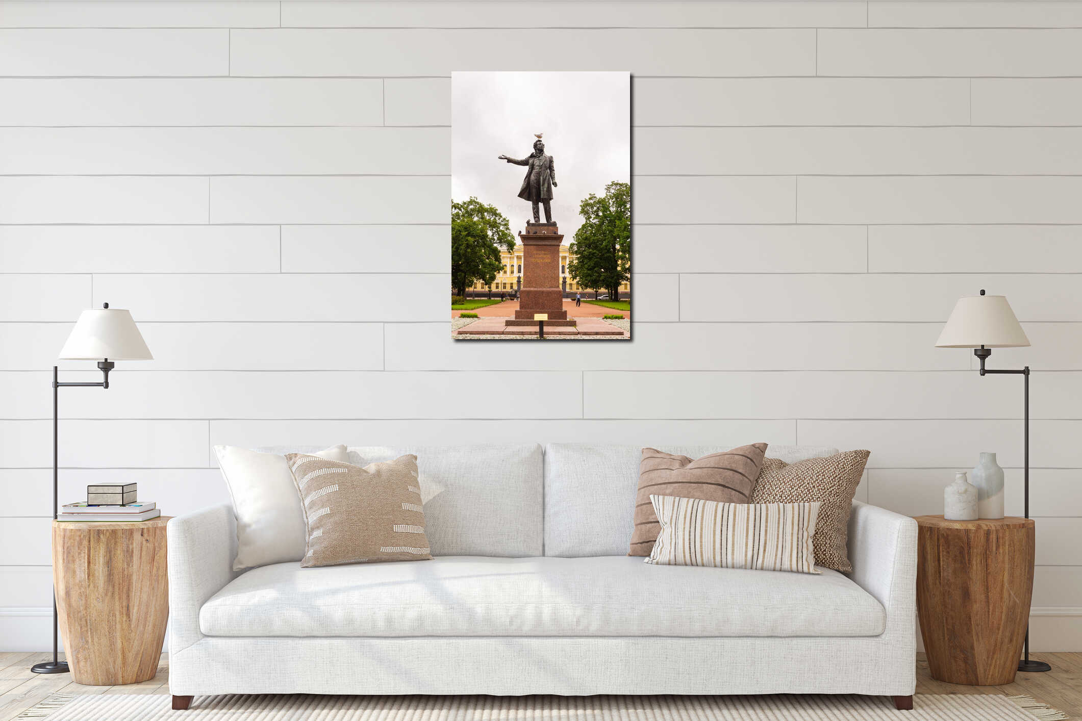 Seagull sits on the head of the monument to Alexander Pushkin on the square in front of the Russian Museum in St. Petersburg, interior mockup