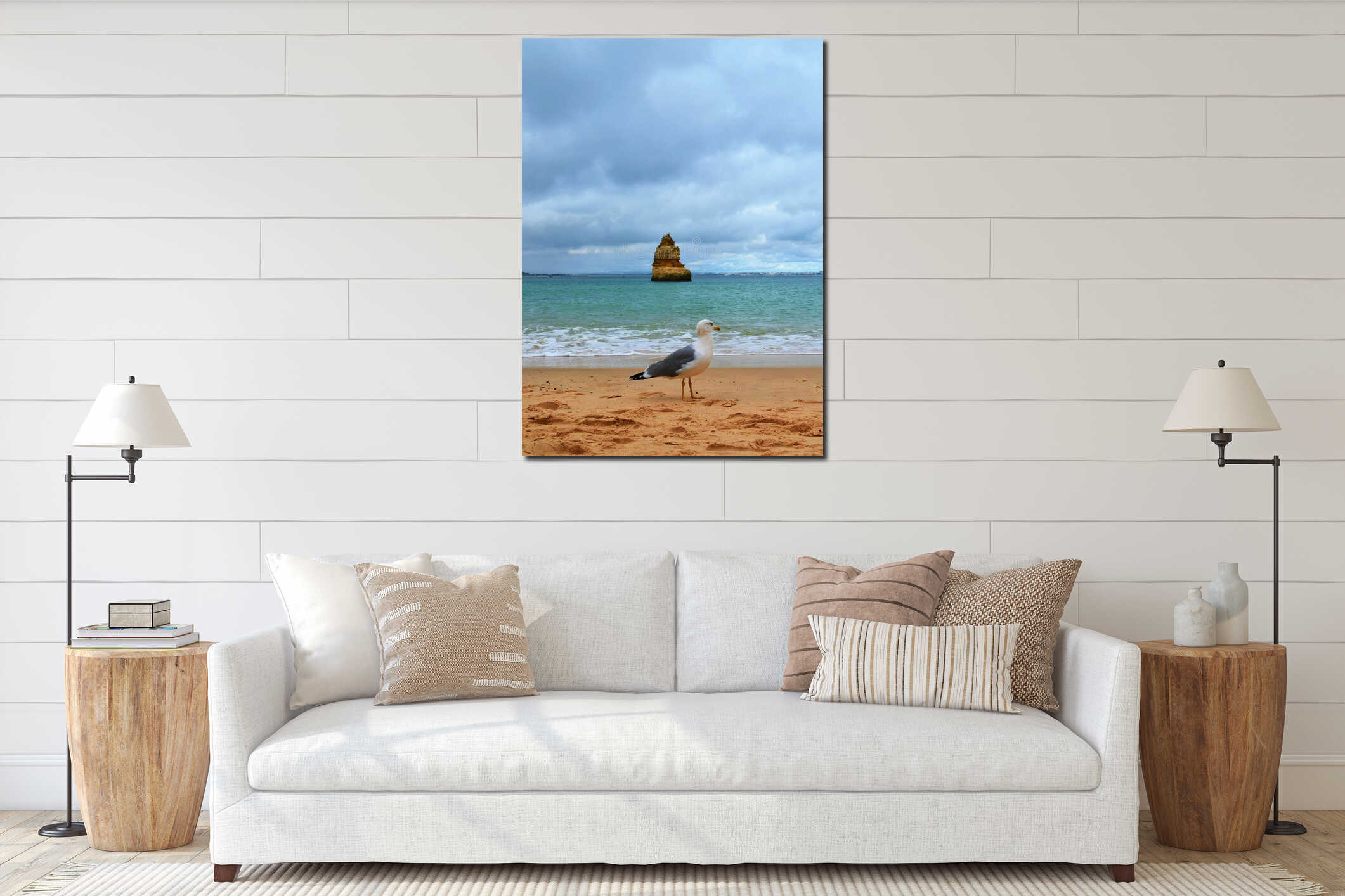 Vertical shot of a seagull on a sandy Lagos beach in Portugal interior mockup