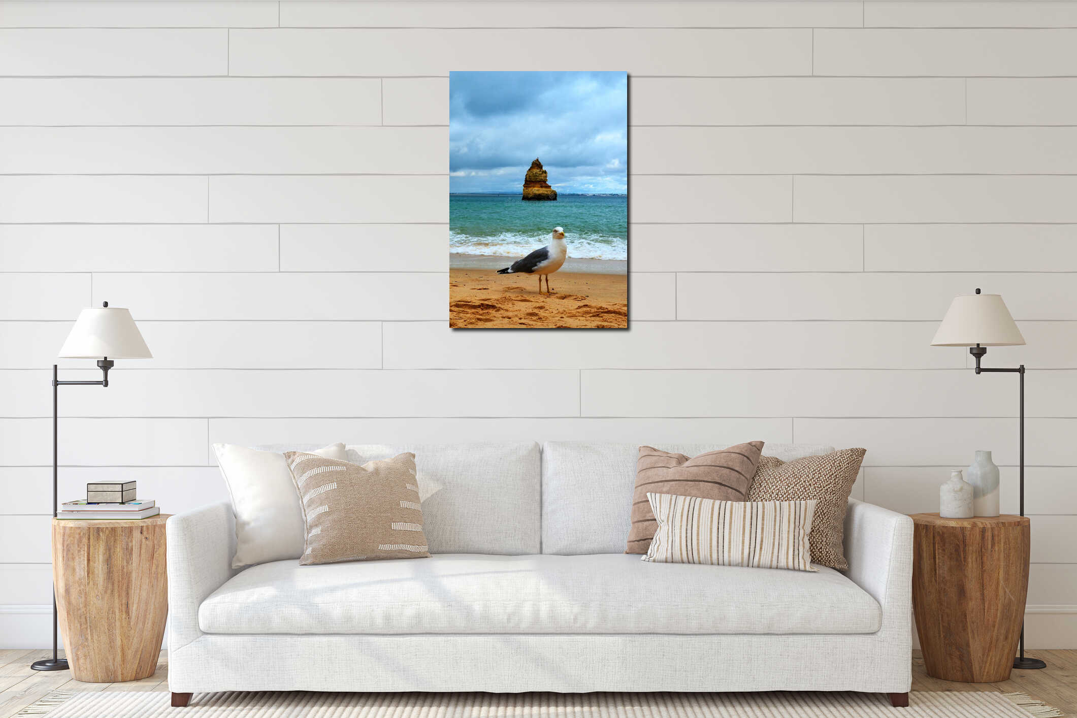 Vertical shot of a seagull on a sandy Lagos beach in Portugal interior mockup