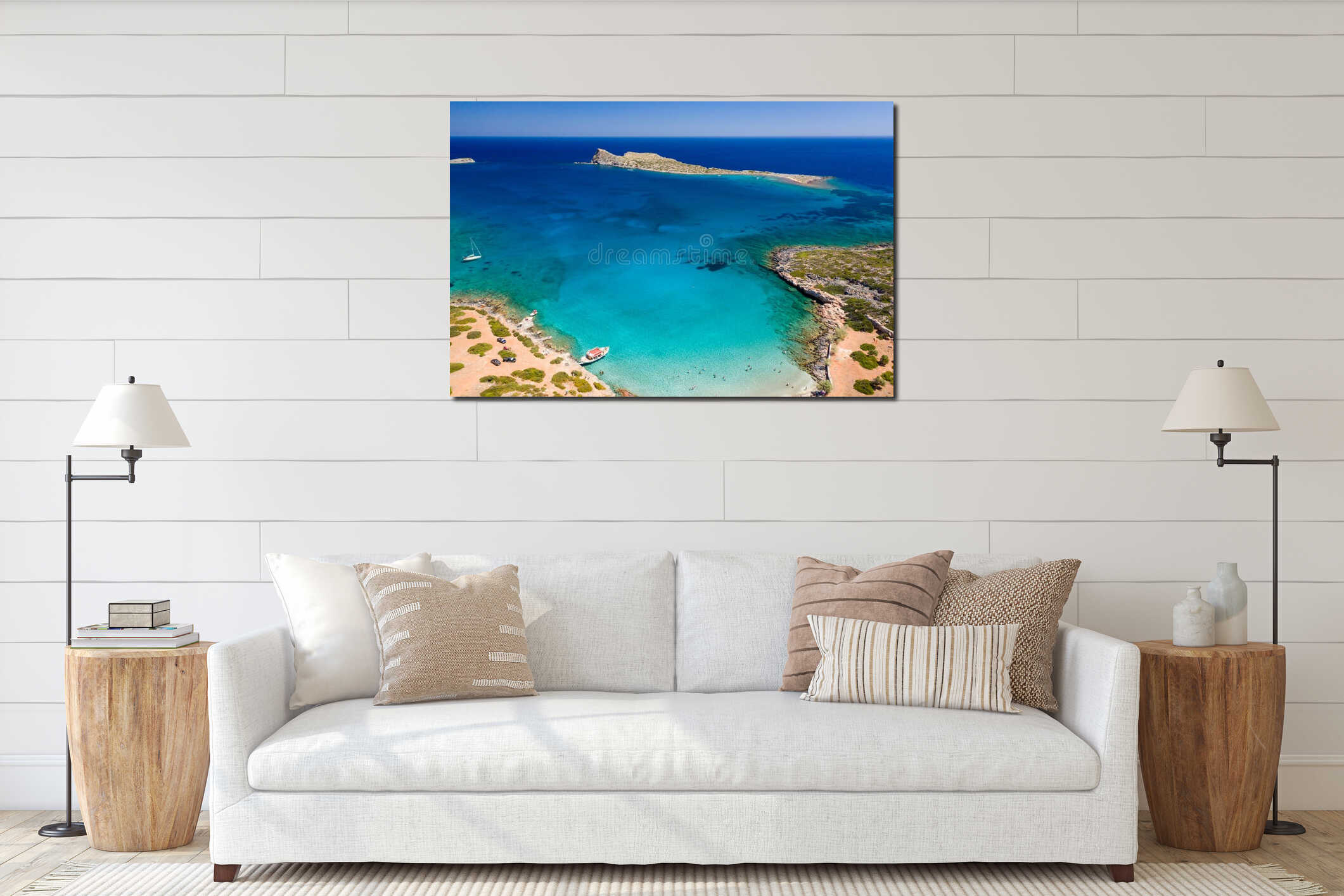 Aerial drone view of a small beach on a rocky, barren coastline and crystal clear ocean interior mockup