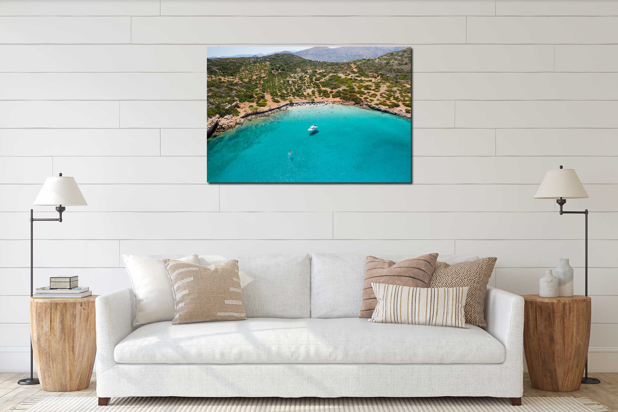Aerial drone view of a small beach on a rocky, barren coastline and crystal clear ocean Kolokitha, Crete, Greece interior mockup