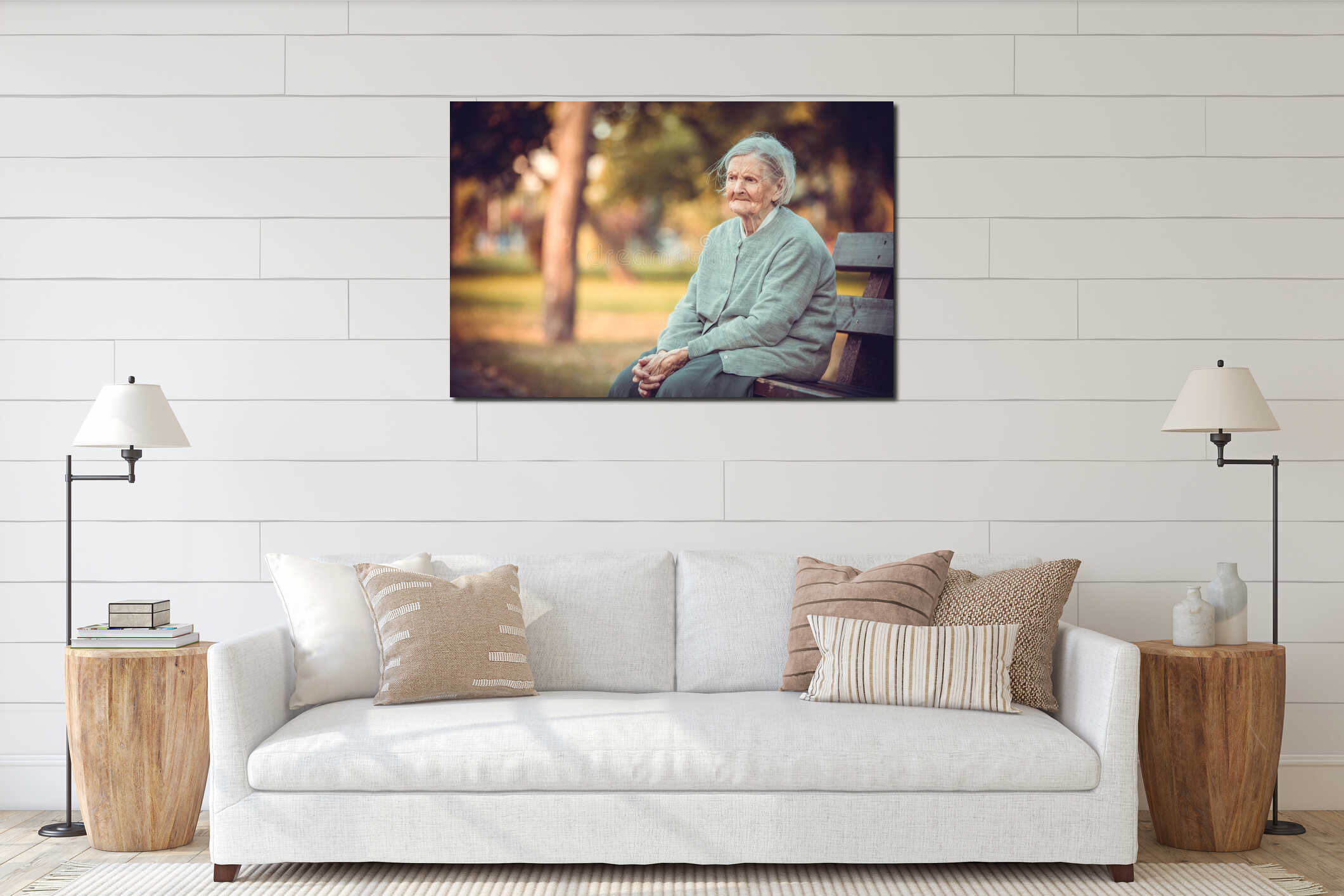 Portrait of senior woman sitting on bench in autumn park. Old lady feeling lonely and sad interior mockup