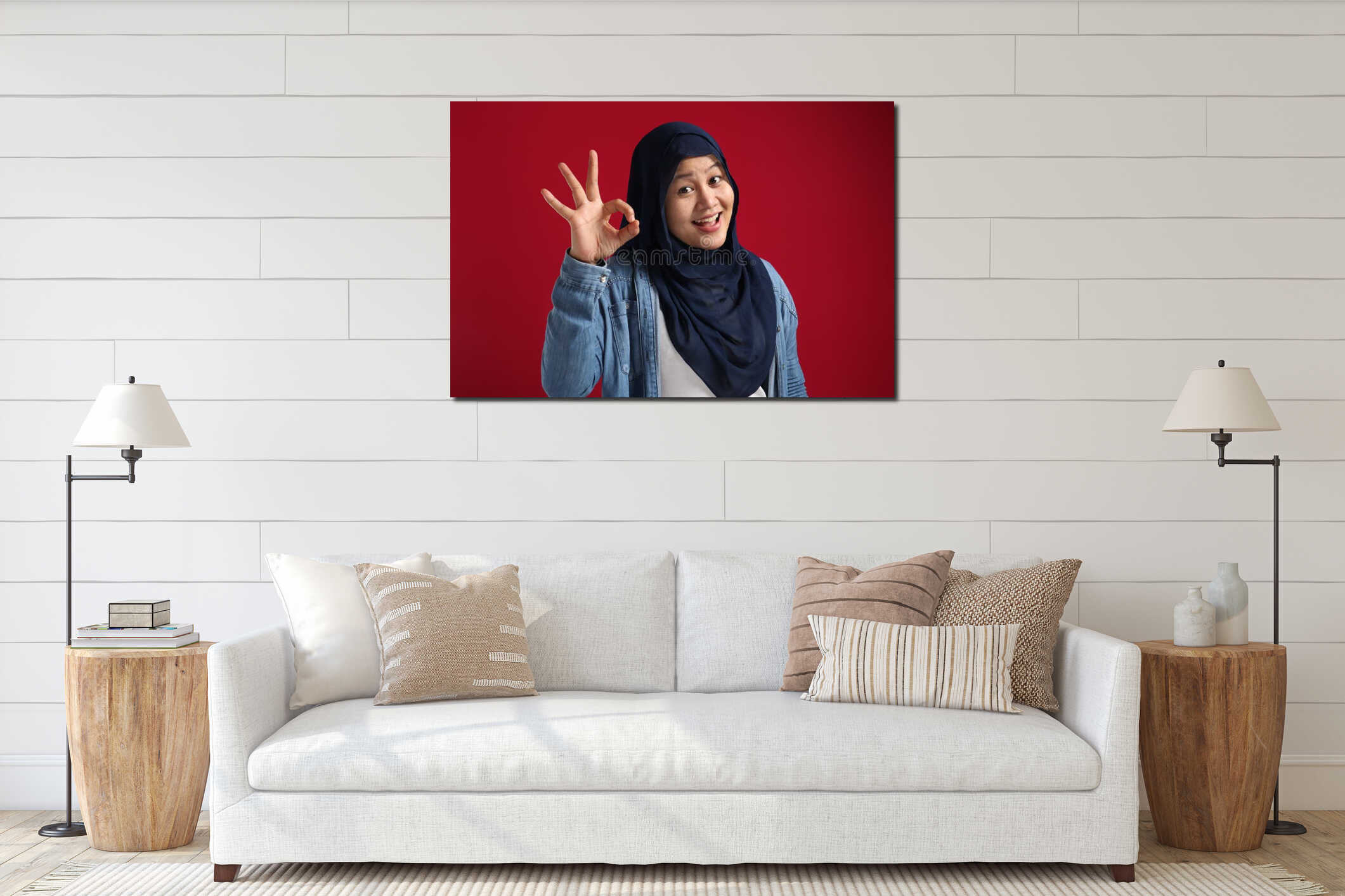Portrait of happy smiling Asian muslim woman shows OK finger sign gesture, against red interior mockup