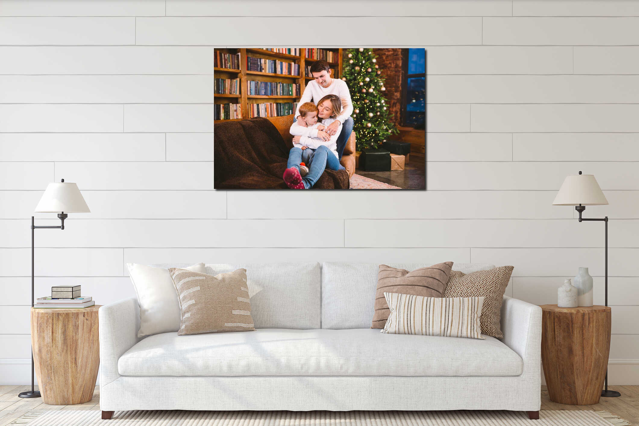 Lovely family with baby son dressed in the same clothes have fun on sofa at home during Christmas. Family Christmas Concept. Happy interior mockup