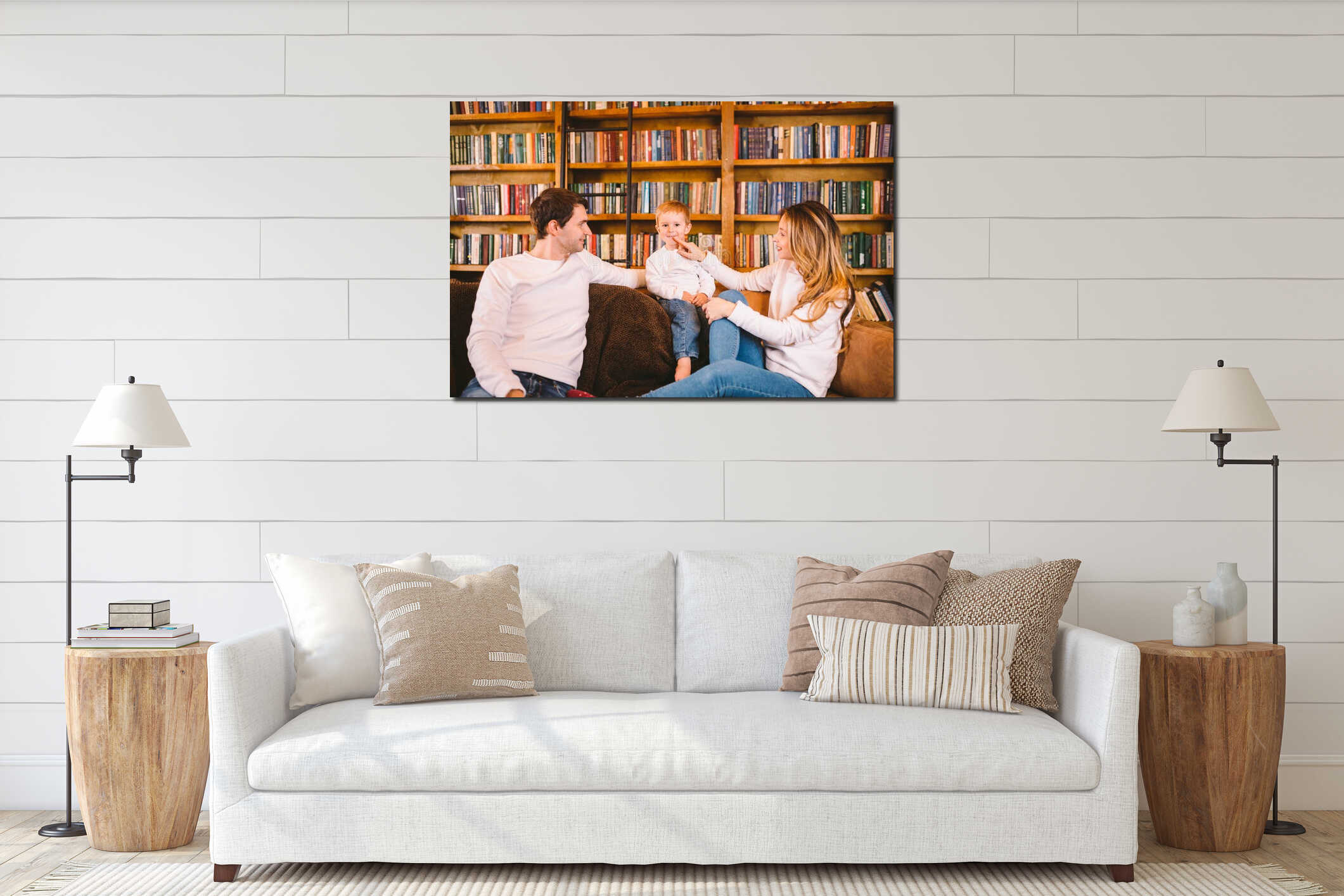 Lovely family with baby son dressed in the same clothes have fun on sofa at home during Christmas. Family Christmas Concept. Happy interior mockup