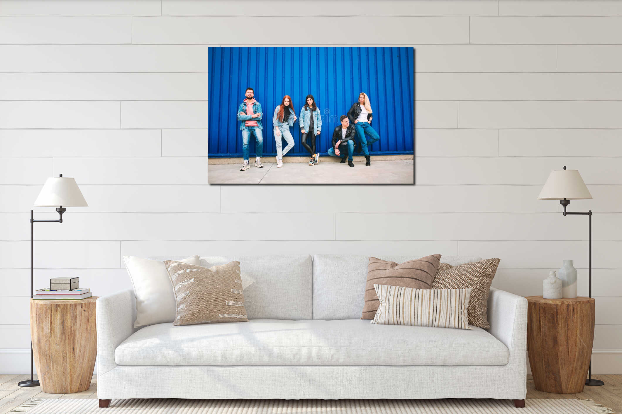 Group of four young diverse friends in jeanse outfit look carefree, young and happy on city`s streets interior mockup