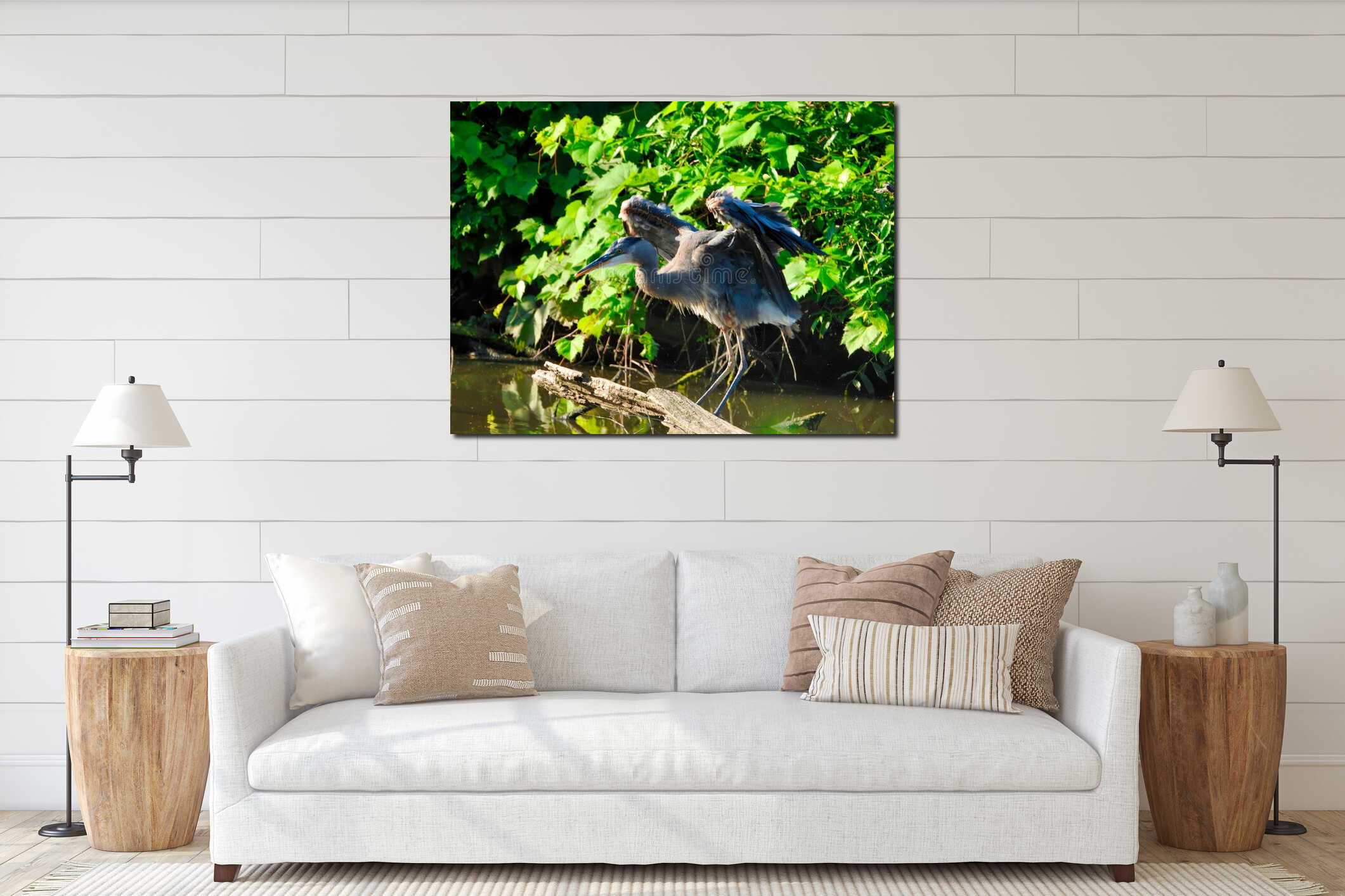 Blue Heron Bird Stretches Wings While Balancing Perched on Dead Tree Branch in Pond interior mockup