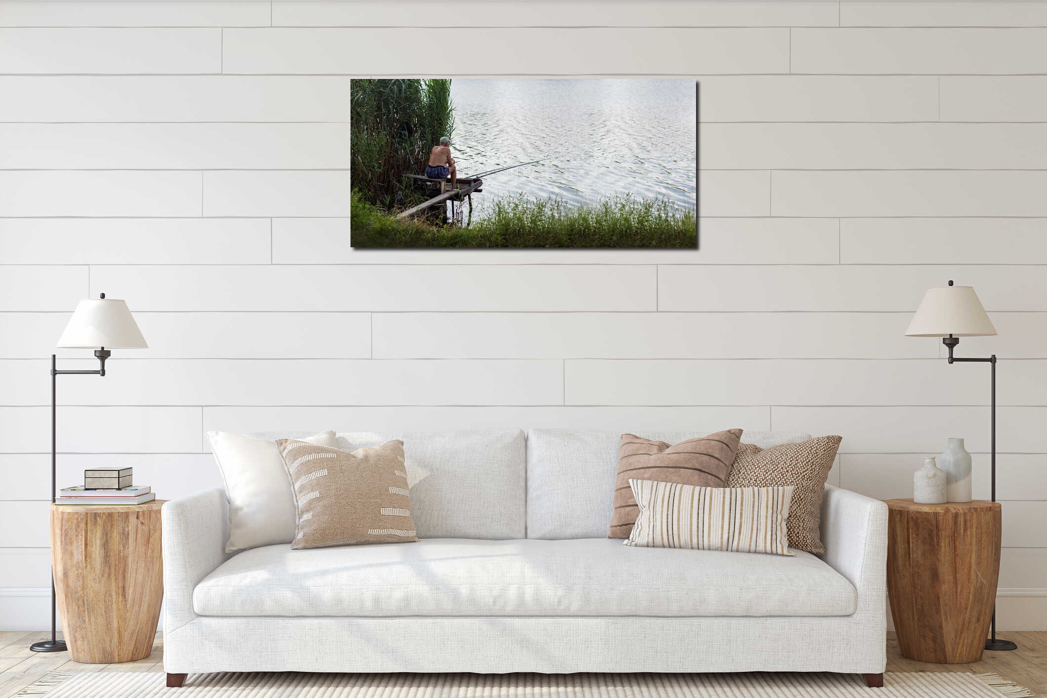 male fisherman sits on a wooden bridge and fishes spinning in the river. interior mockup