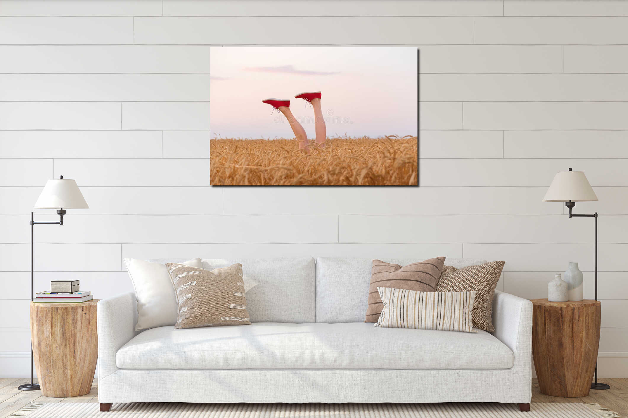 Feet in red sneakers sticking out of a wheat field. Legs on field and sky background interior mockup