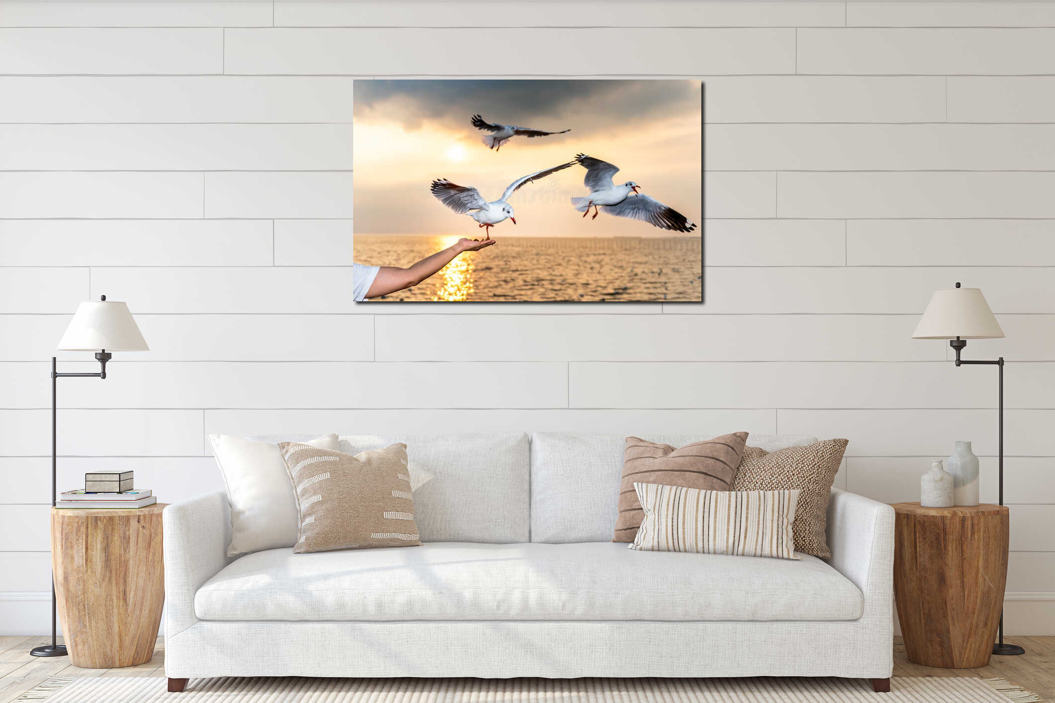Seagull With red mouths and feet, eating food in people`s hands, with sky and sea interior mockup
