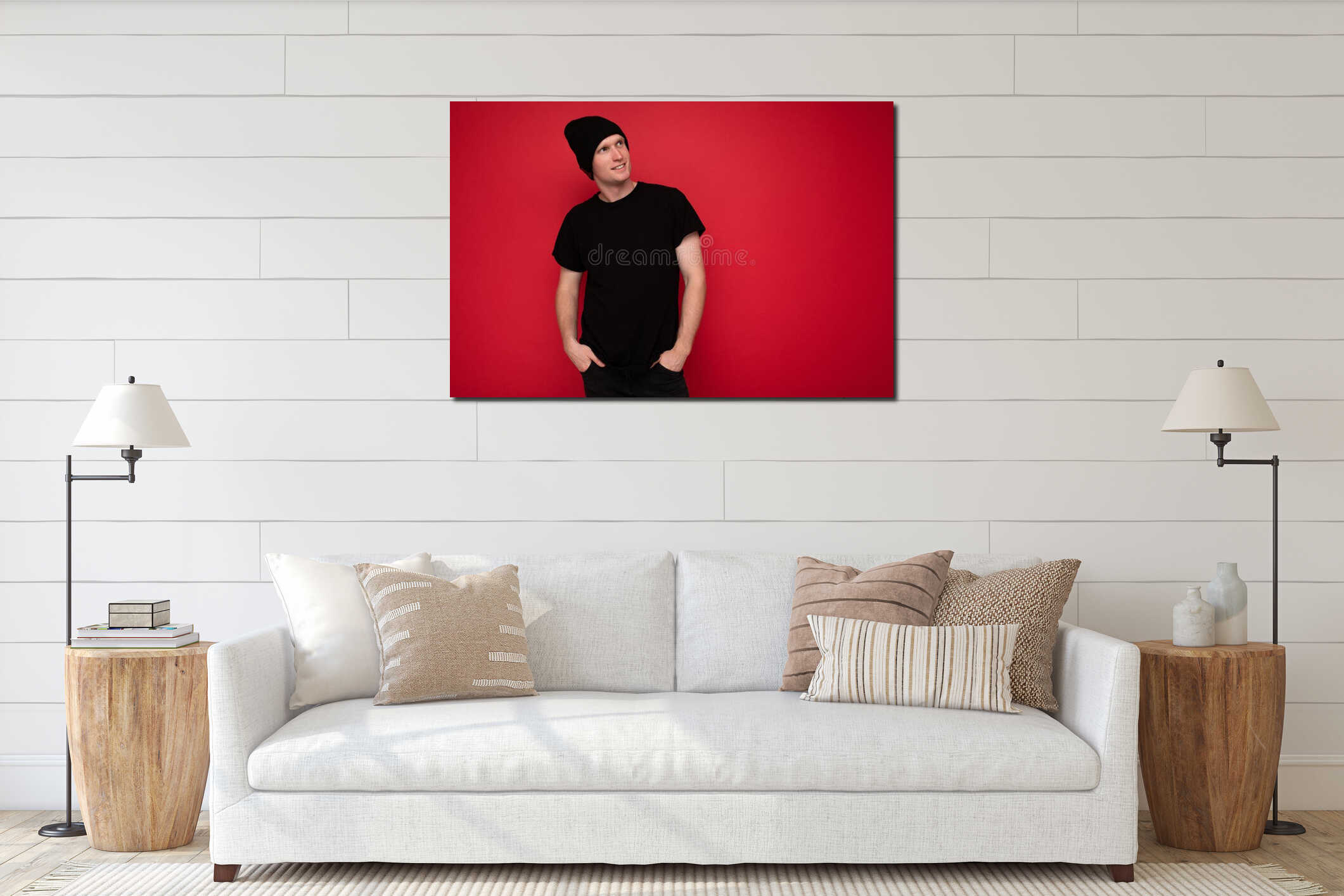 Shot of handsome positive thoughtful adult male person standing isolated over red background wall wearing black t-shirt interior mockup