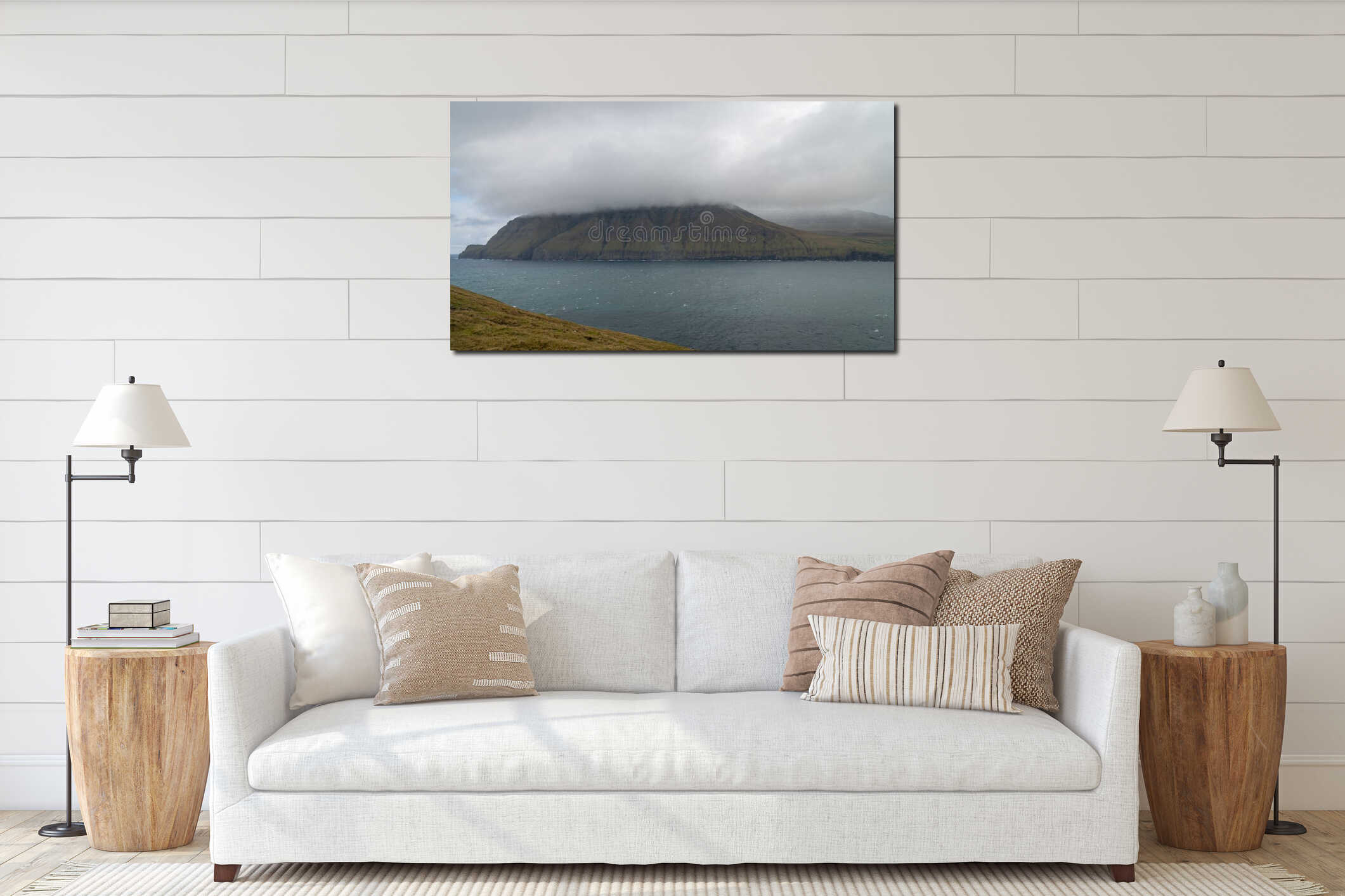 Dramatic landscape on Faroe Islands with clouds over the mountain in the north Atlantic interior mockup