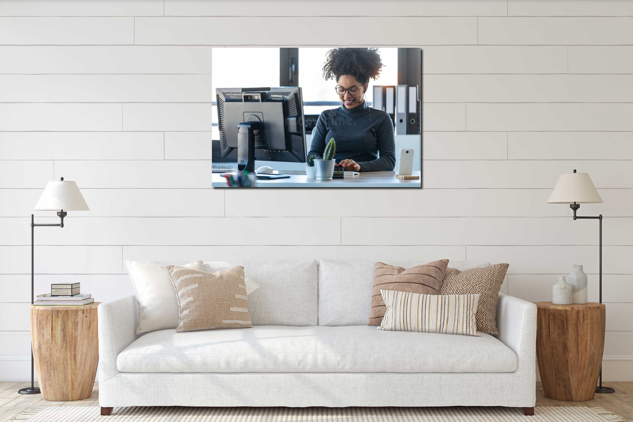 Beautiful young afro business woman working while making video call with computer sitting in the office interior mockup