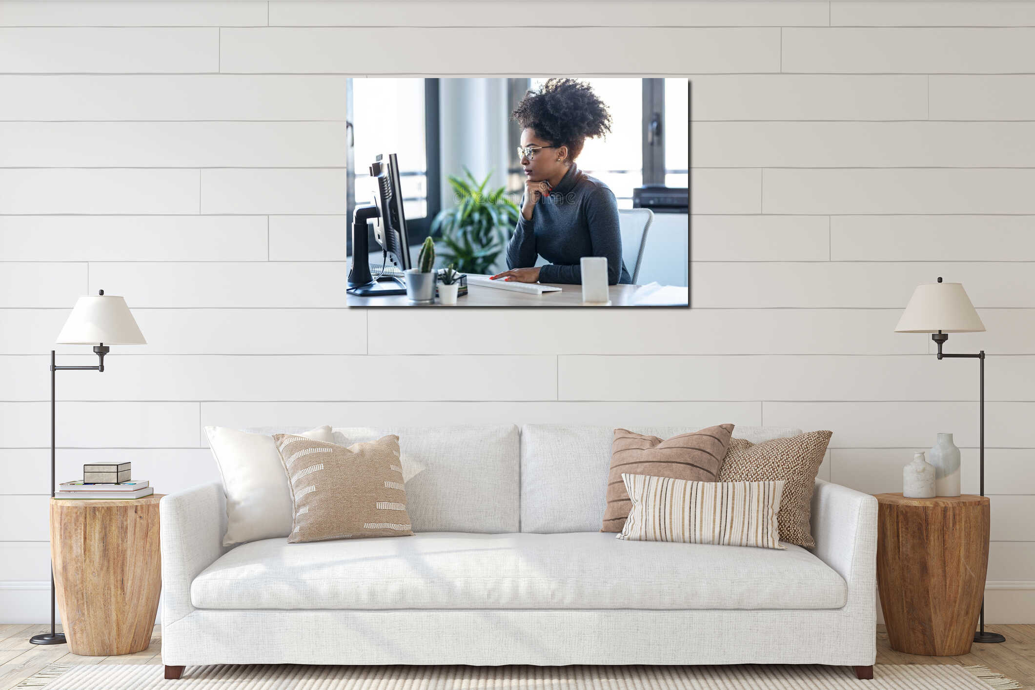 Beautiful young afro business woman working while making video call with computer sitting in the office interior mockup