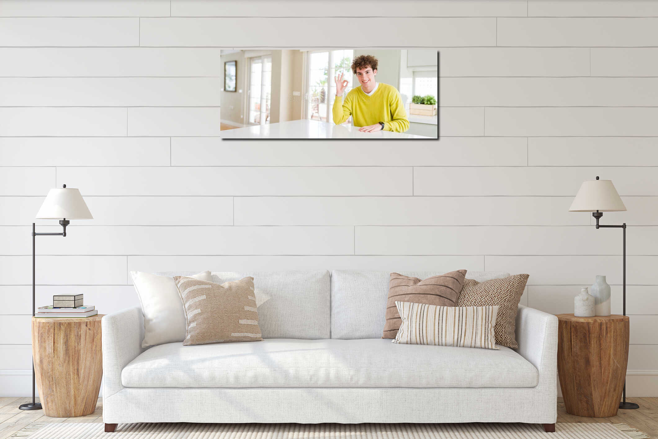 Wide angle shot of young handsome man at home smiling positive doing ok sign with hand and fingers interior mockup