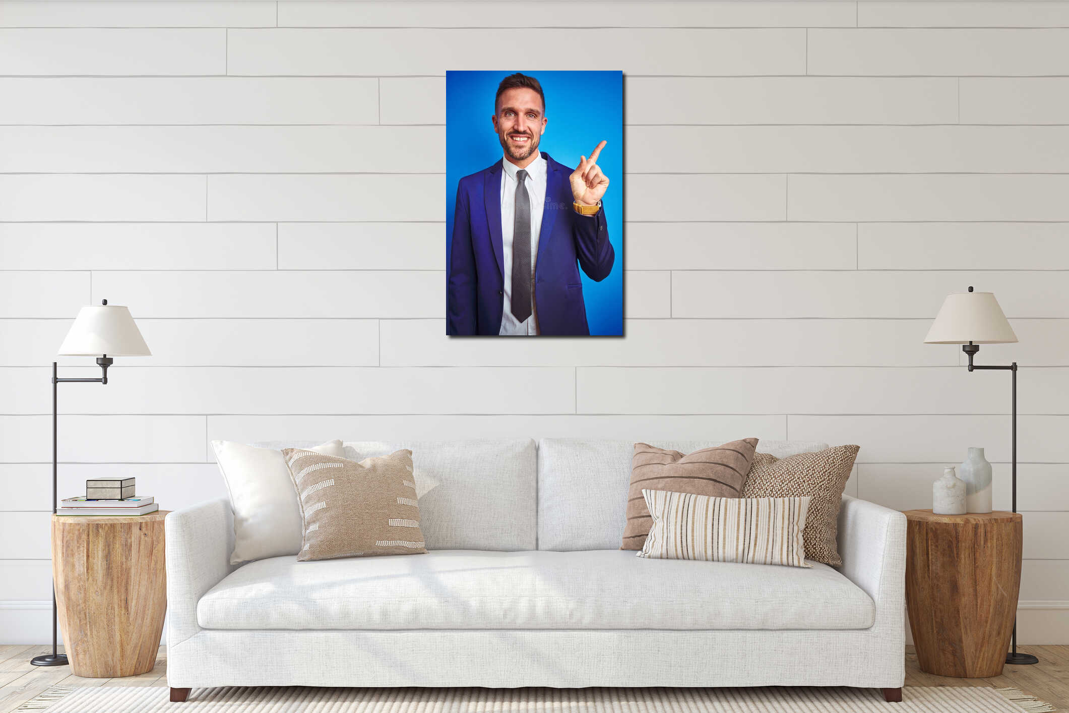 Vertical angle picture of young handsome business man over blue isolated background with a big smile on face, pointing with hand interior mockup