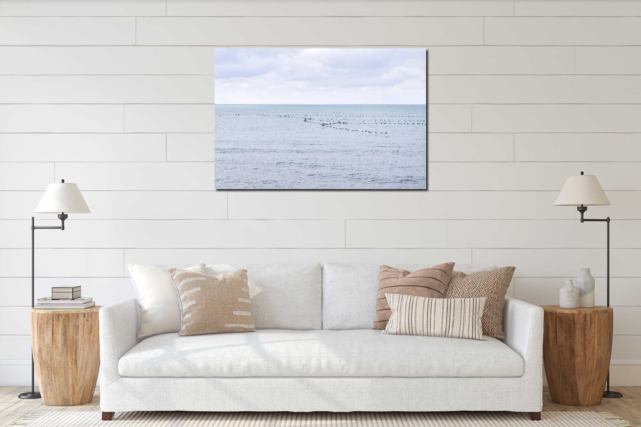 Seascape with a flock of migratory birds flying low over the water interior mockup