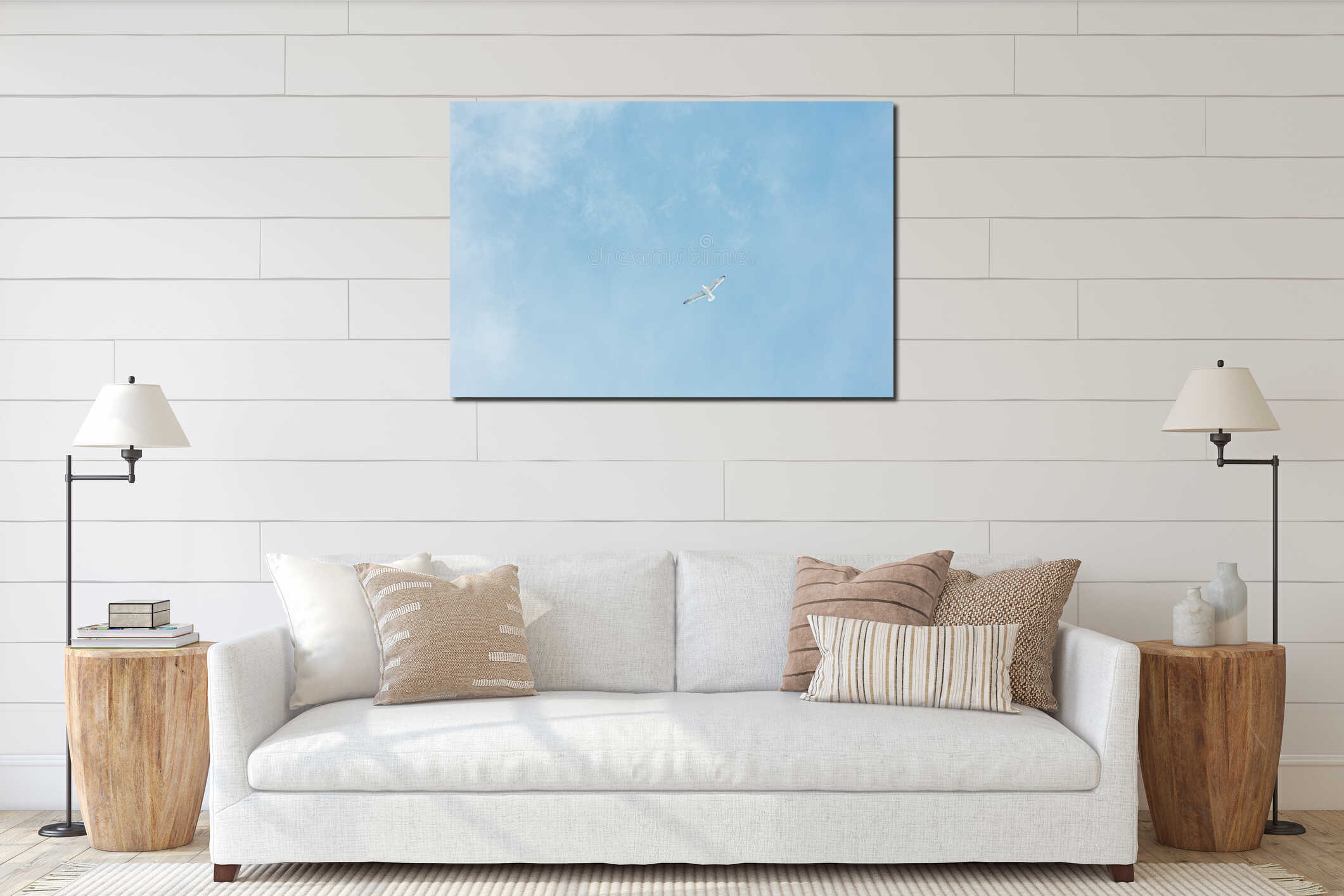 Small Ivory gull flies in the blue light cloudy sky. Minimalistic photo interior mockup