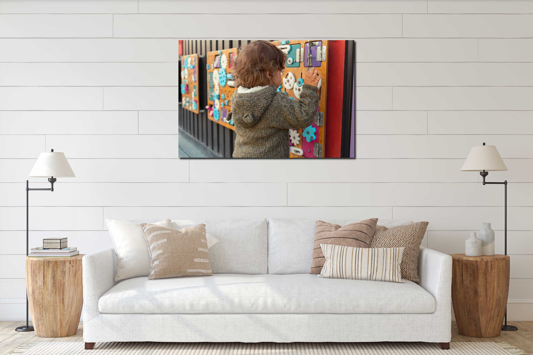 Portrait of a modern little boy playing with a busy board outdoors interior mockup