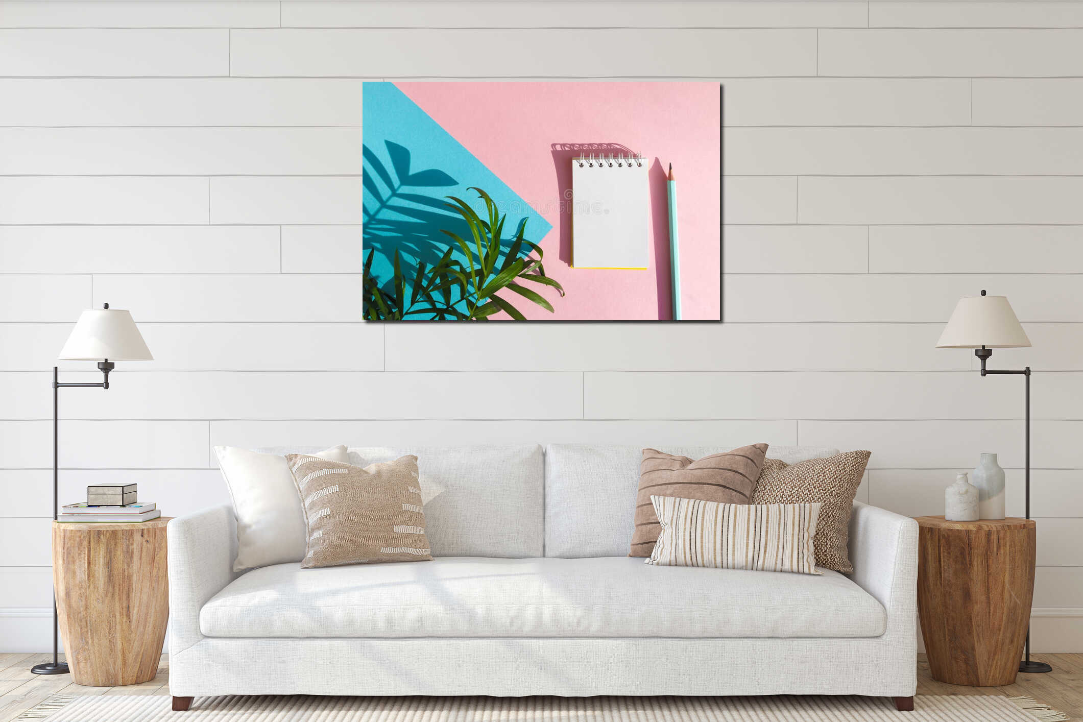 Modern summer stationery mock up. Shadow of tropical palm tree leaves and empty note pad with pencil on blue and pink background. interior mockup