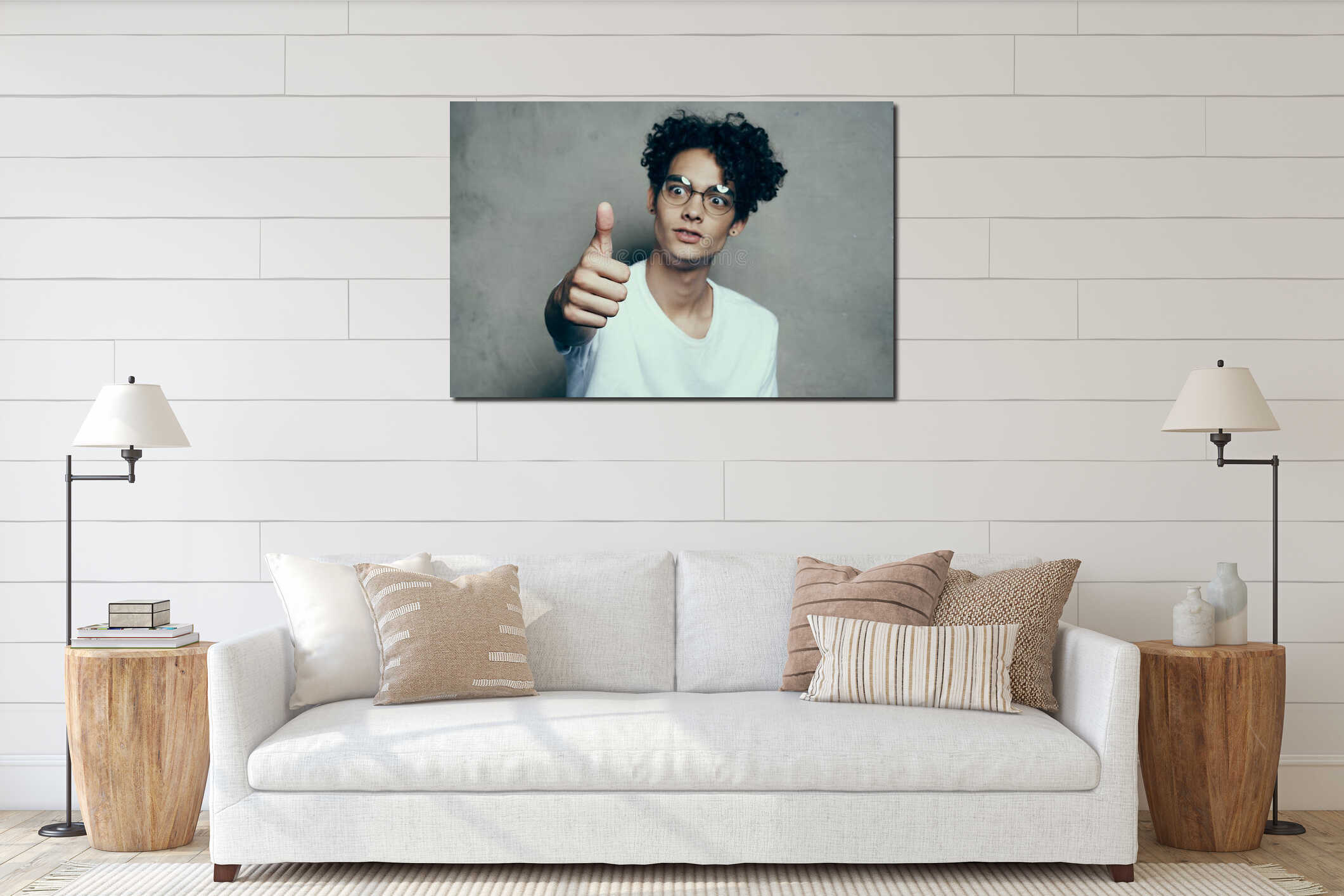 Cheerful cute guy with curly hair shows thumb up emotions interior mockup