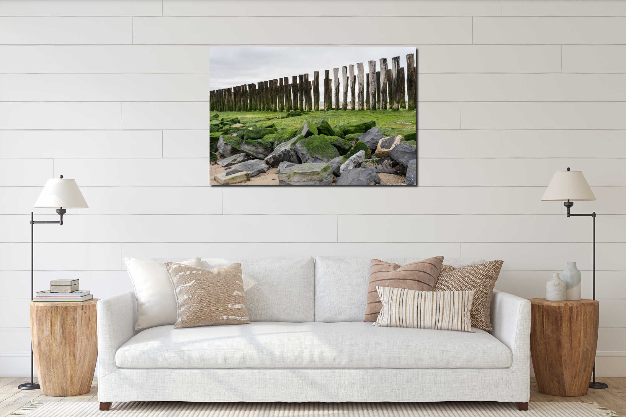 Seascape with traditional wooden pillars at the Dutch coast, province of Zeeland, North Sea on the horizon interior mockup