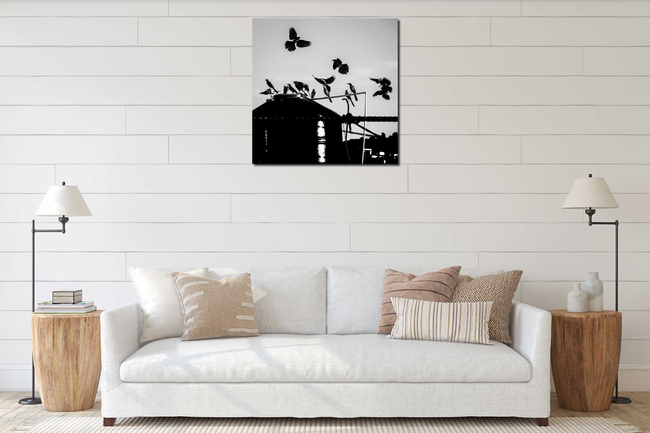 Silhouette of a flock of birds perched and some flying around a huge tank in a farm interior mockup