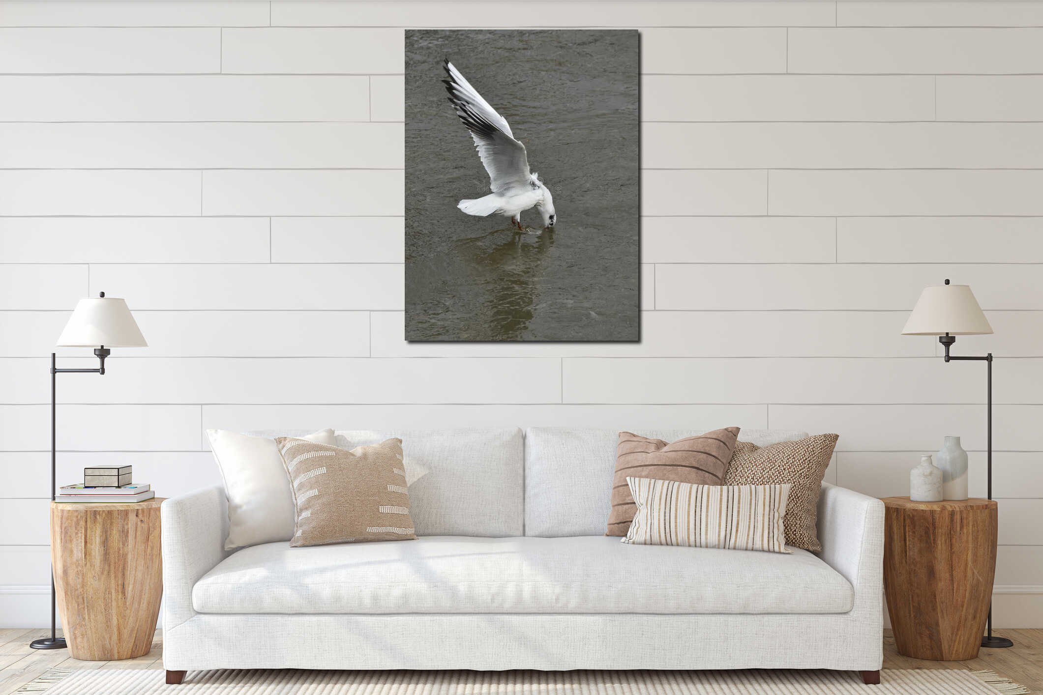 Vertical shot of a Seagull sinking into the water to find food interior mockup