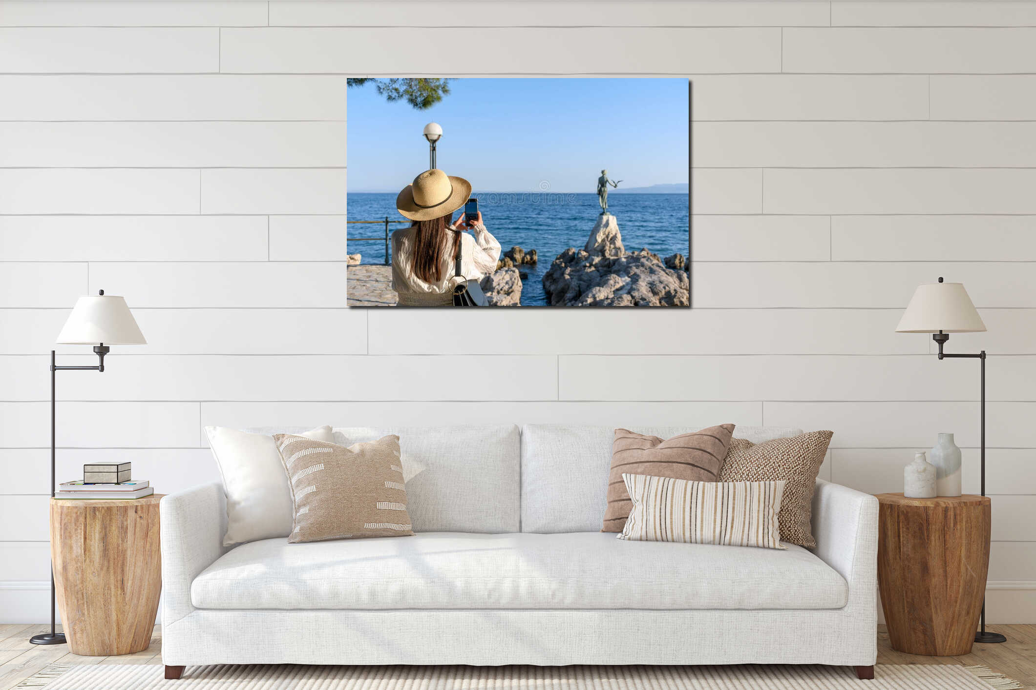 Woman taking photos of a Statue of a maiden with seagull on rocky coast in Opatija, Croatia. interior mockup