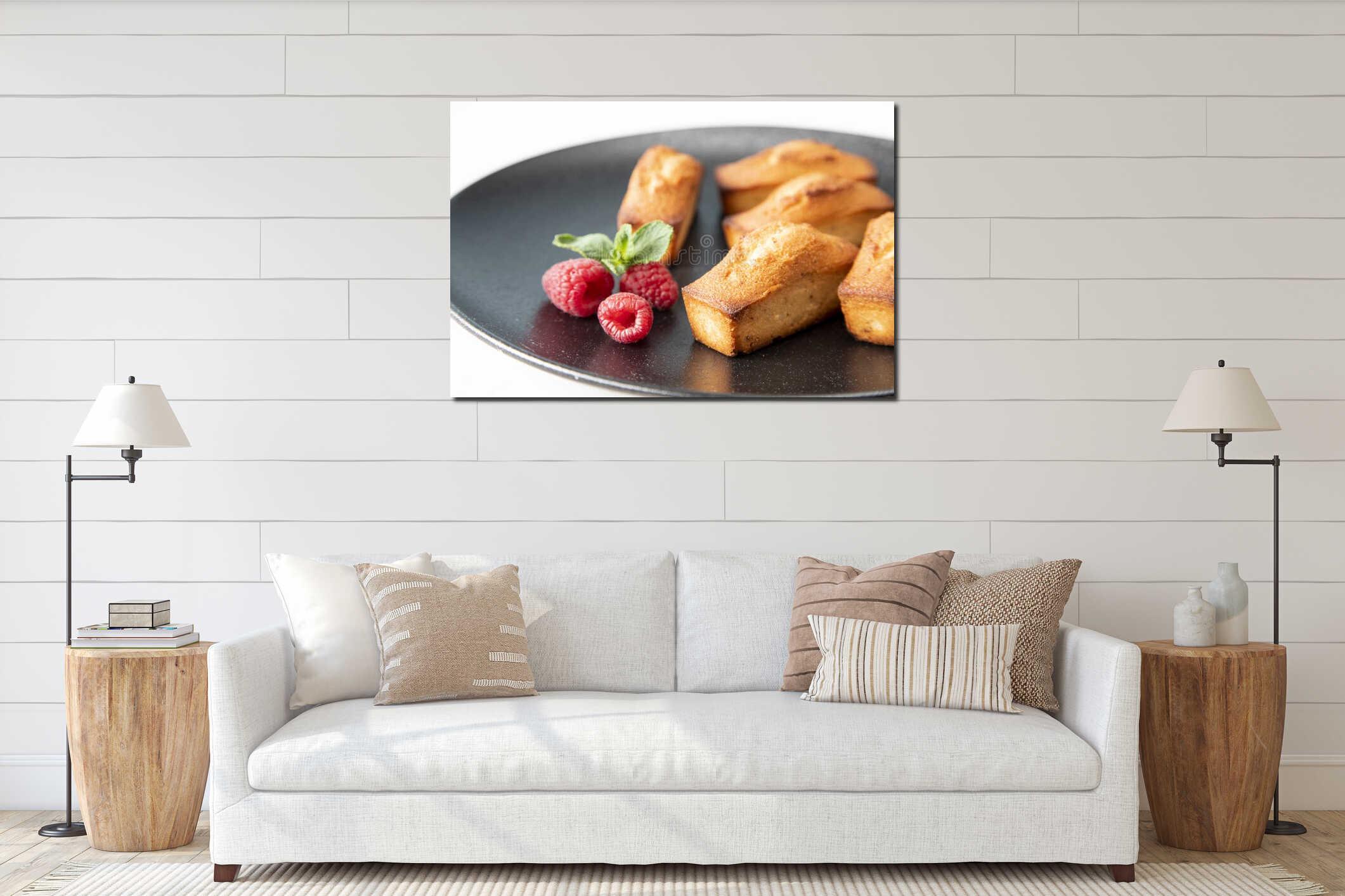 Financier cake - traditional French food on a large, beautiful black plate with raspberries and a mint leaf - a festive concept interior mockup