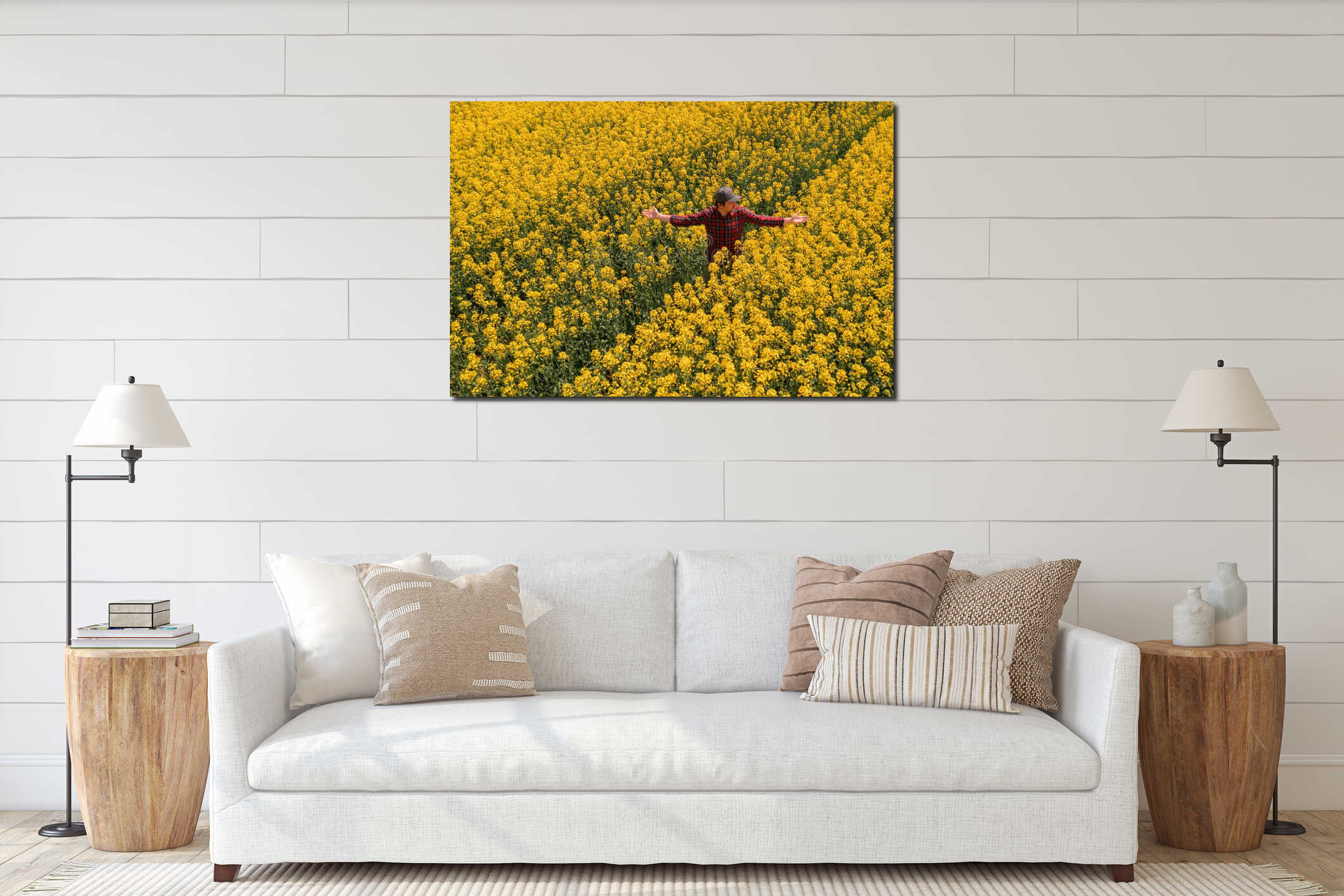 Aerial view of confident successful male farmer standing in blooming rapeseed field interior mockup