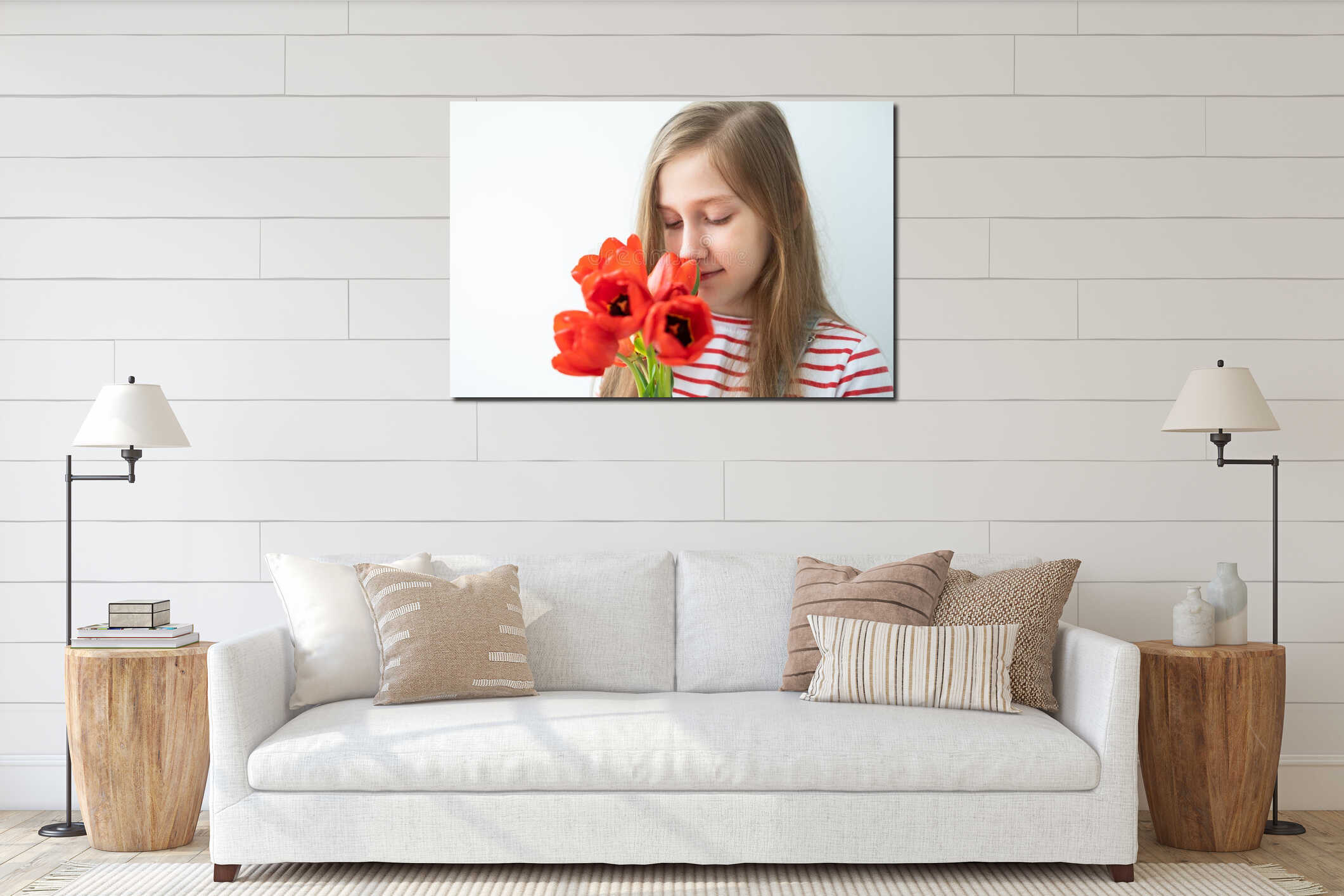 portrait happy teenage girl with long hair with red tulips standing against white wall interior mockup