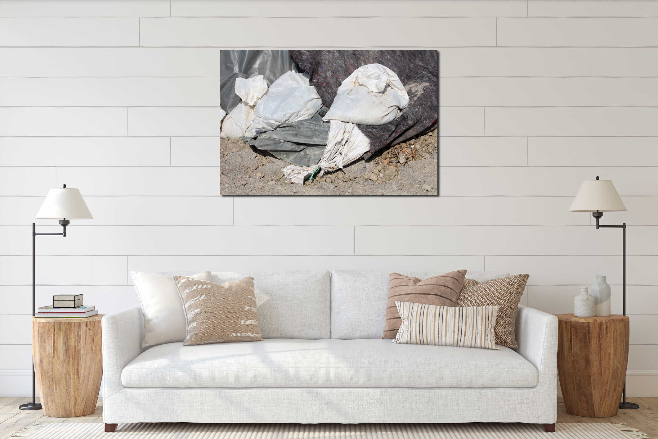 Bunch of new and old broken sandbags holding thick dark nylon and geotextile fabric covering temporary flood protection wall interior mockup