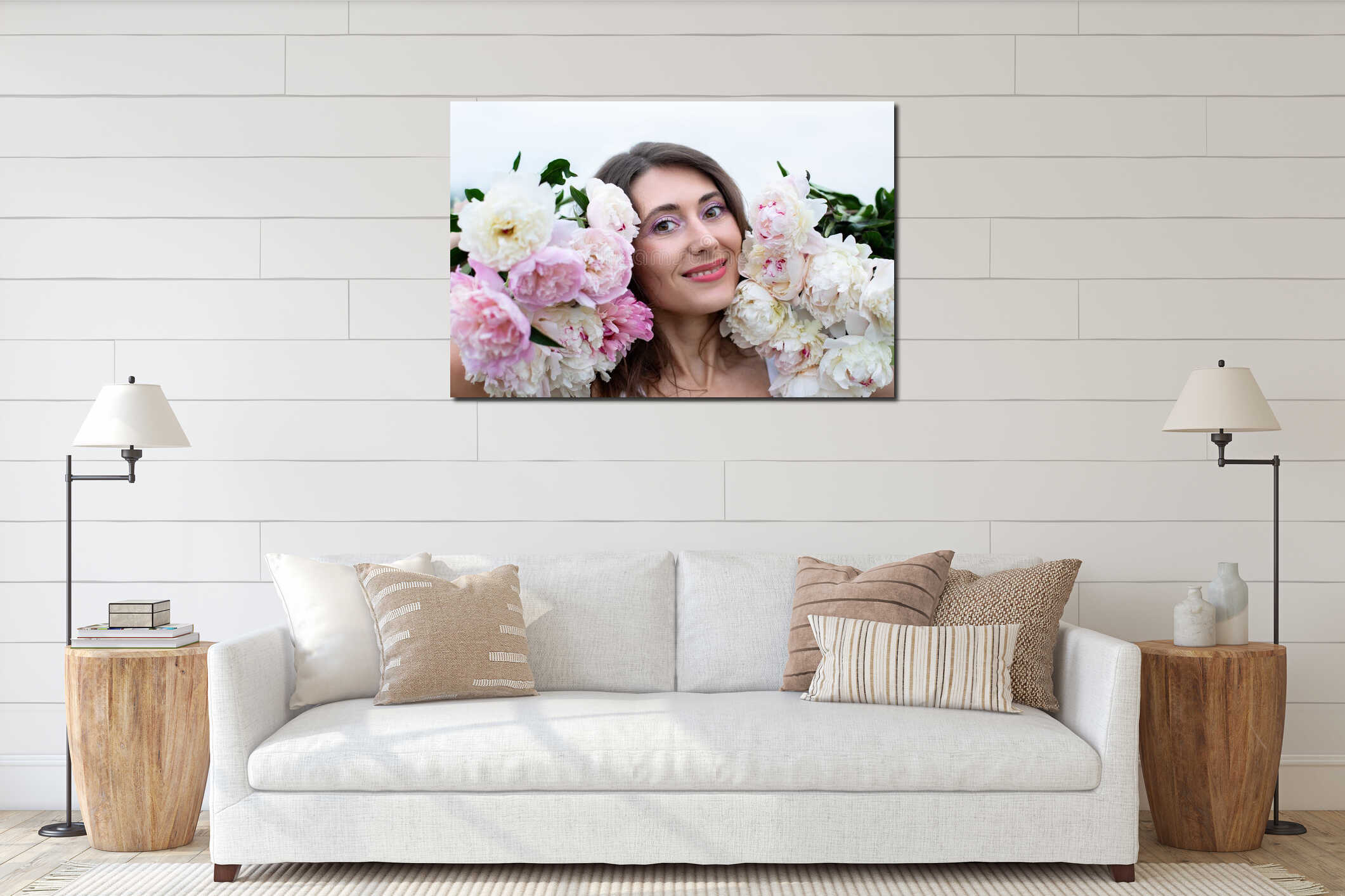 Smiling woman with a bouquet of peonies. Close-up portrait of a beautiful brunette woman among peony flowers. Beauty and flowers. interior mockup