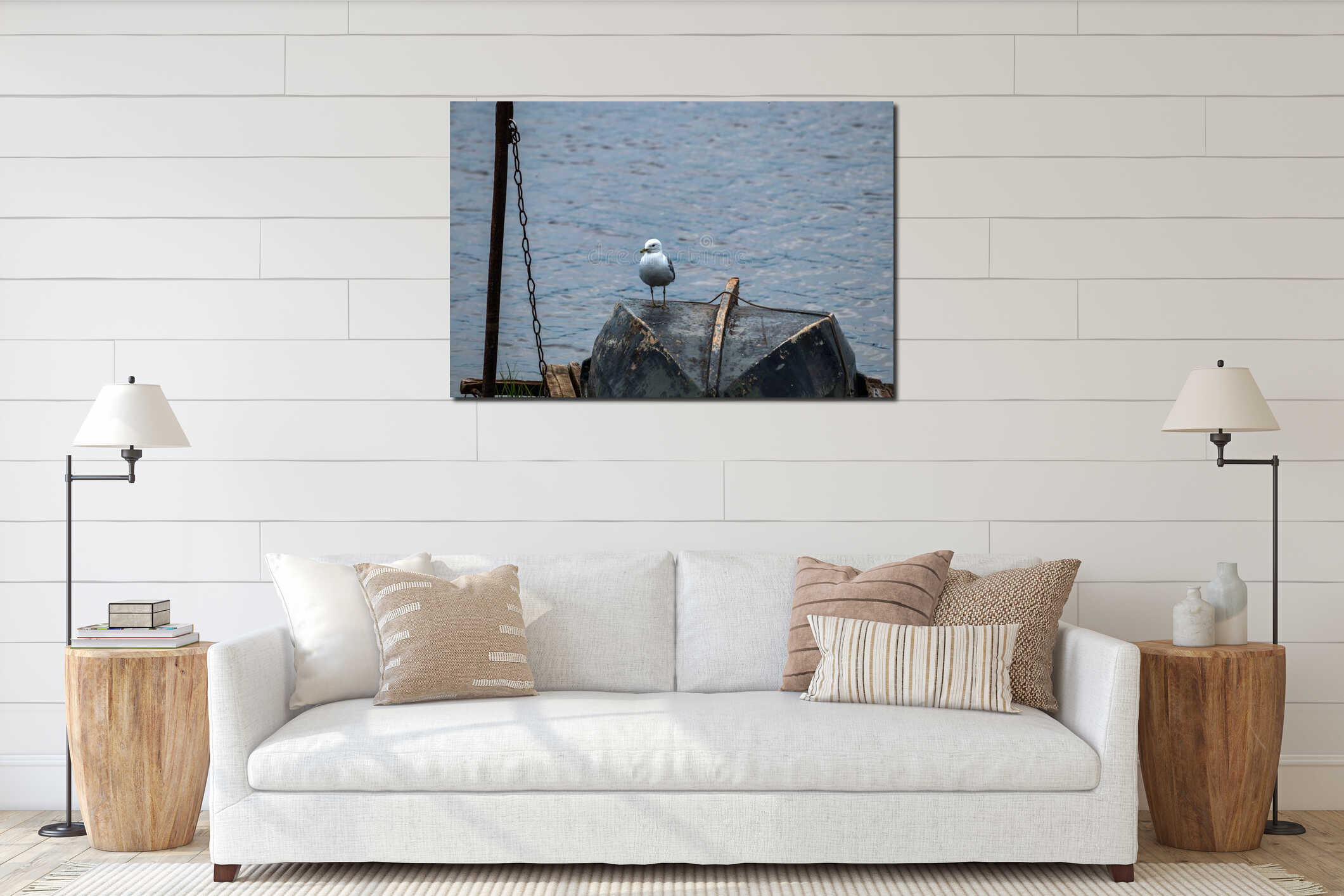 White bird Seagull on an old upturned wooden boat on the dock by the river interior mockup