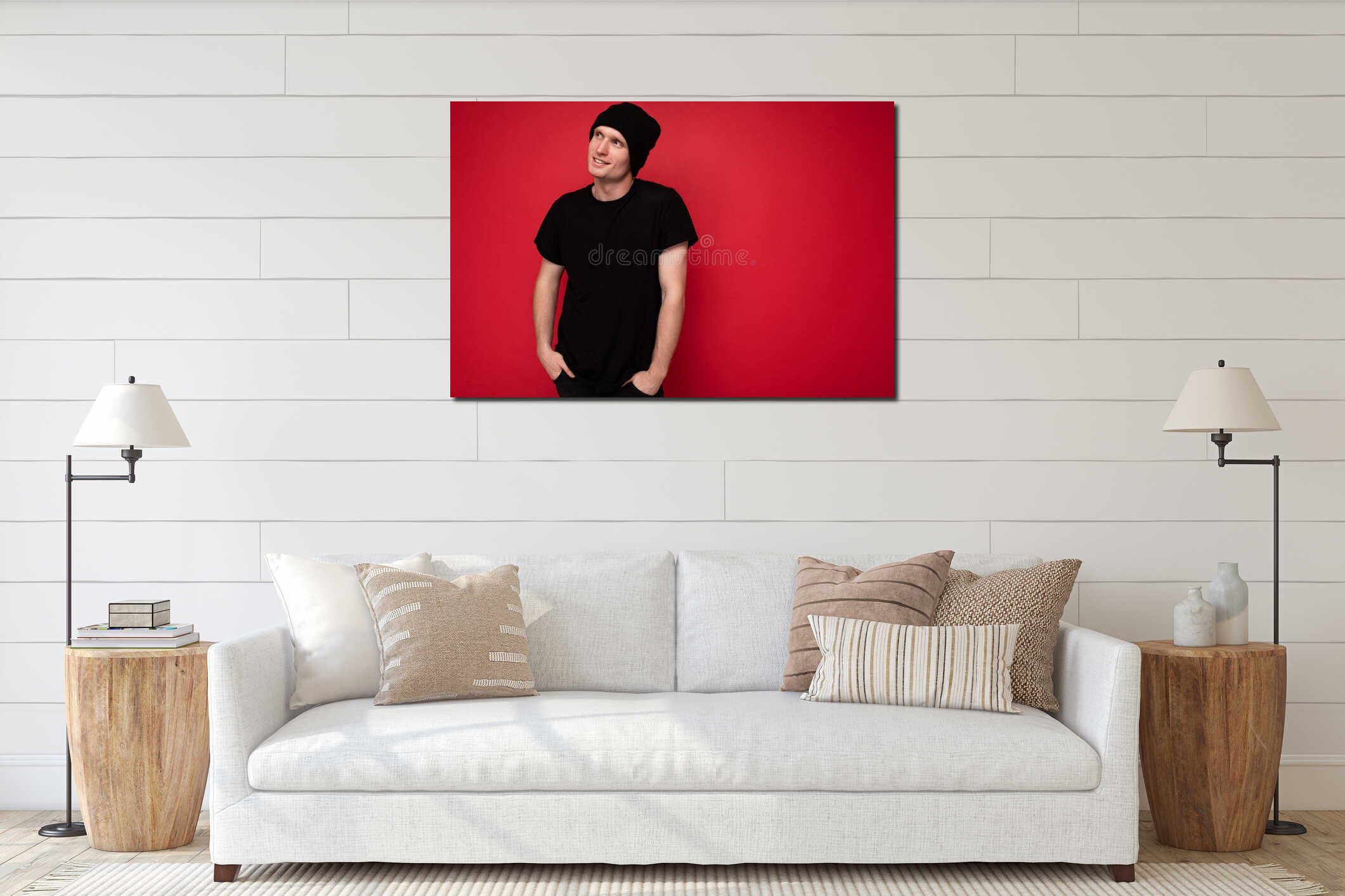 Shot of handsome positive young male person standing isolated over red background wall wearing black t-shirt for mockup interior mockup