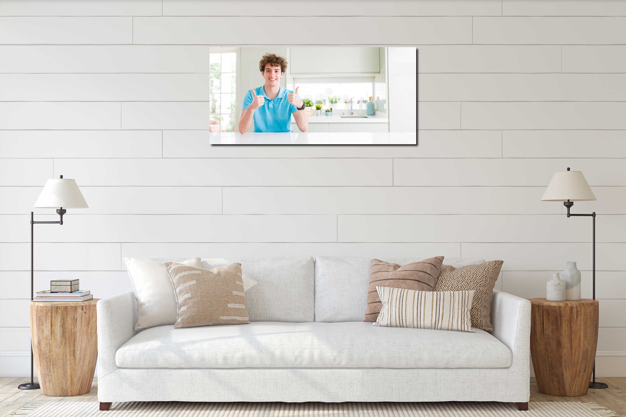 Wide shot of young handsome man at home success sign doing positive gesture with hand, thumbs up smiling and happy interior mockup