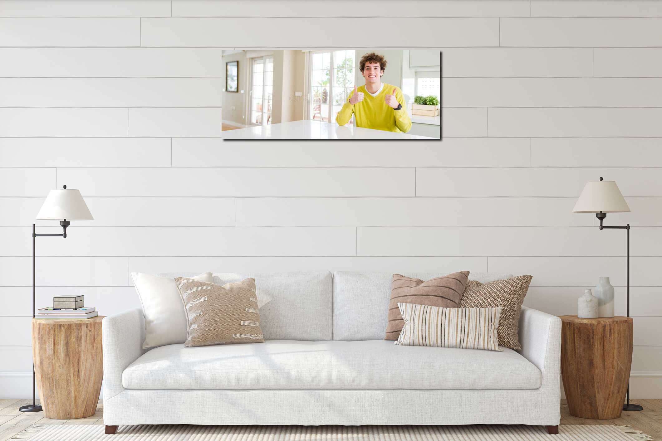 Wide angle shot of young handsome man at home success sign doing positive gesture with hand, thumbs up smiling and happy interior mockup