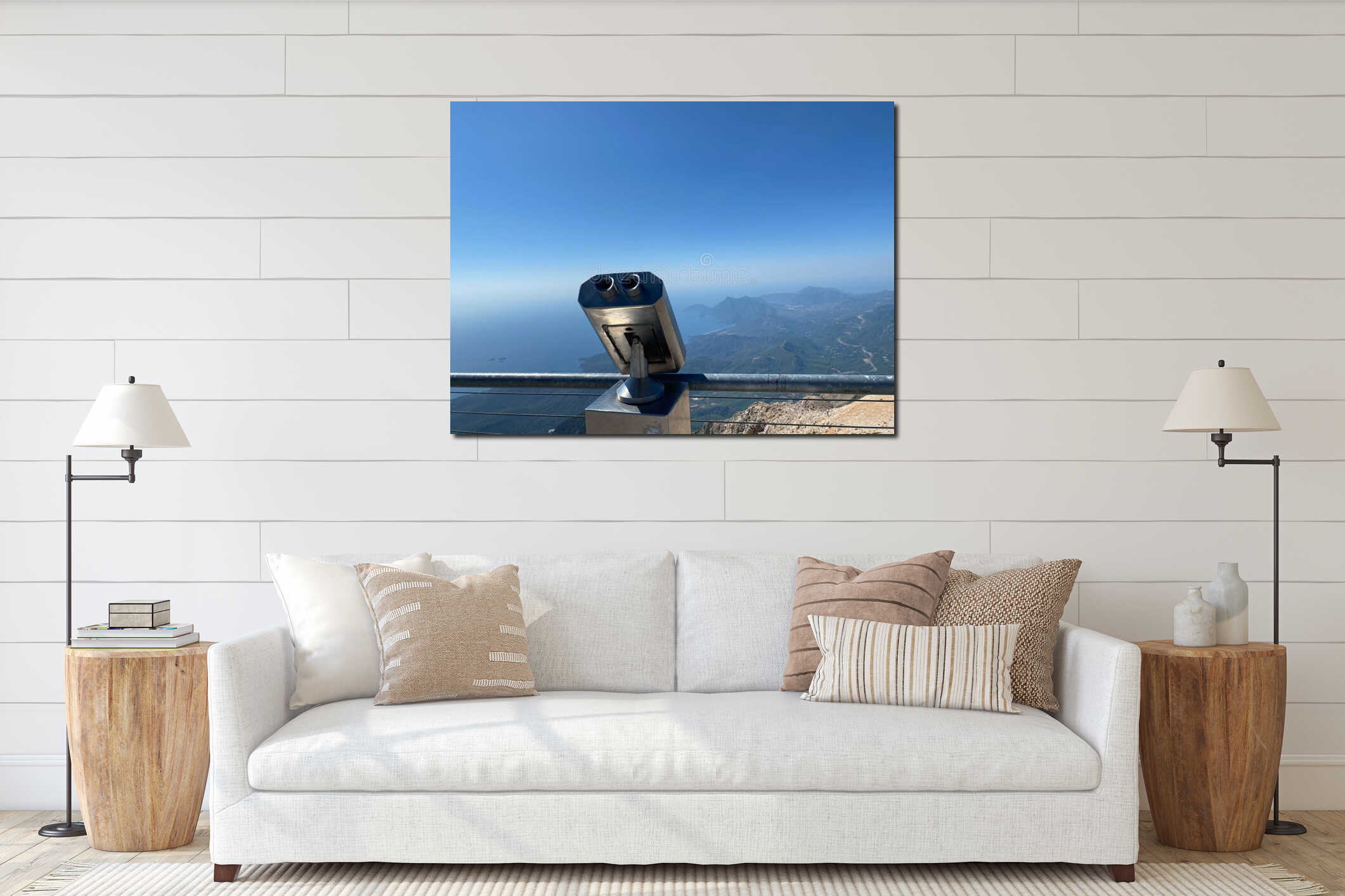 Metal gray stationary binoculars on the observation deck with views of the sea, mountains and the town. Seascape from the high interior mockup