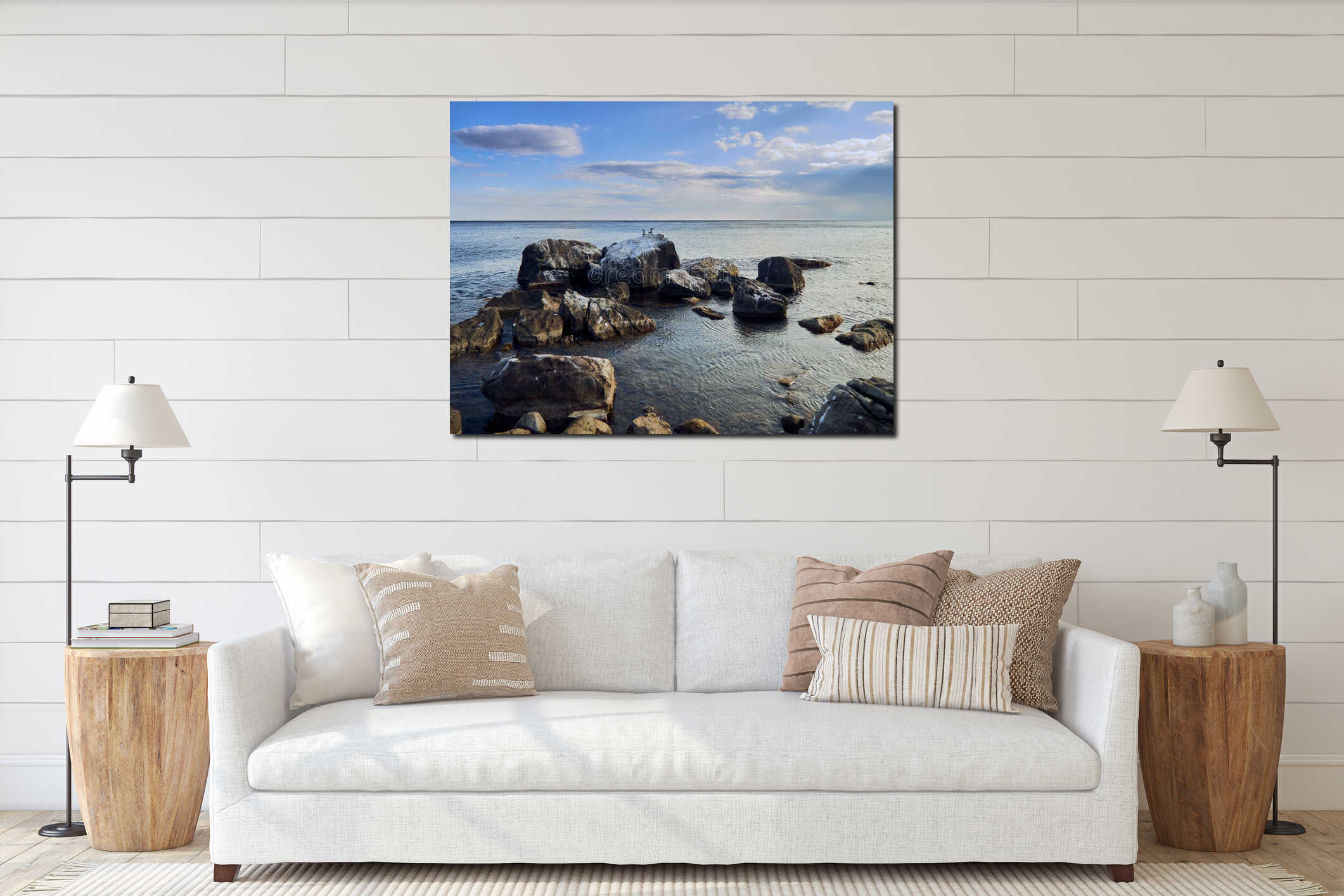 huge stones lie on the coast of the sea, the sea is calm interior mockup