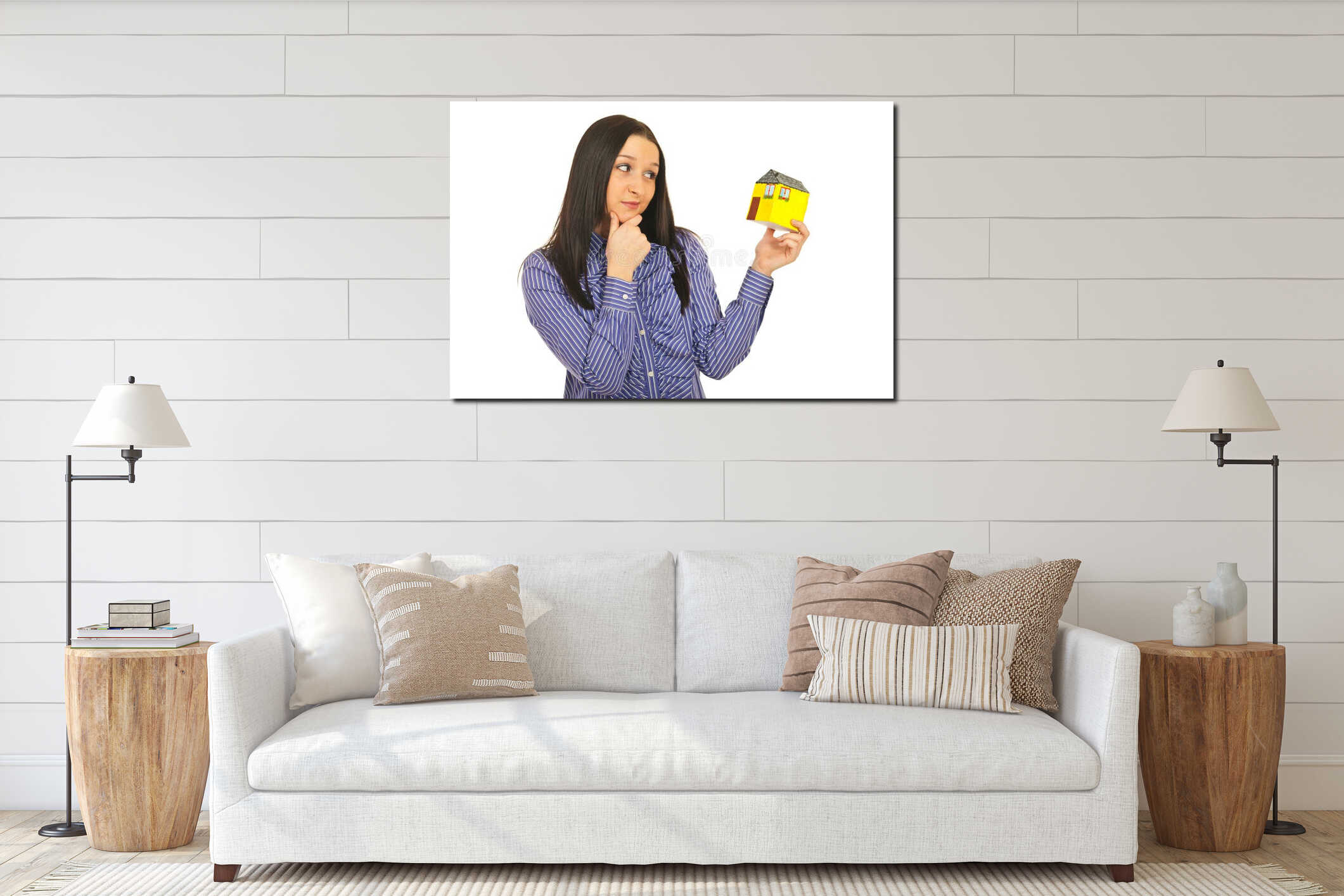 Pensive woman holding miniature house interior mockup