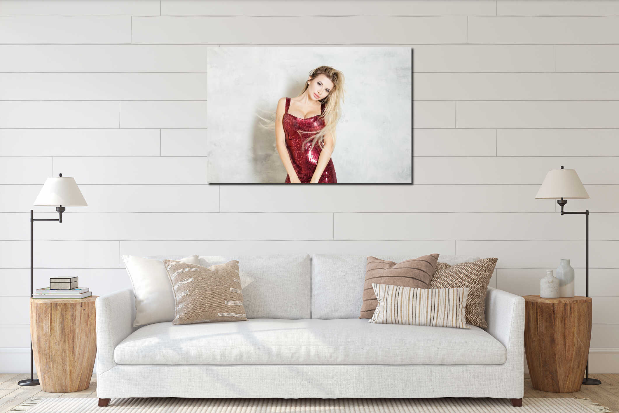 Young attractive blonde woman in red dress joyfully looking at camera on white studio background interior mockup