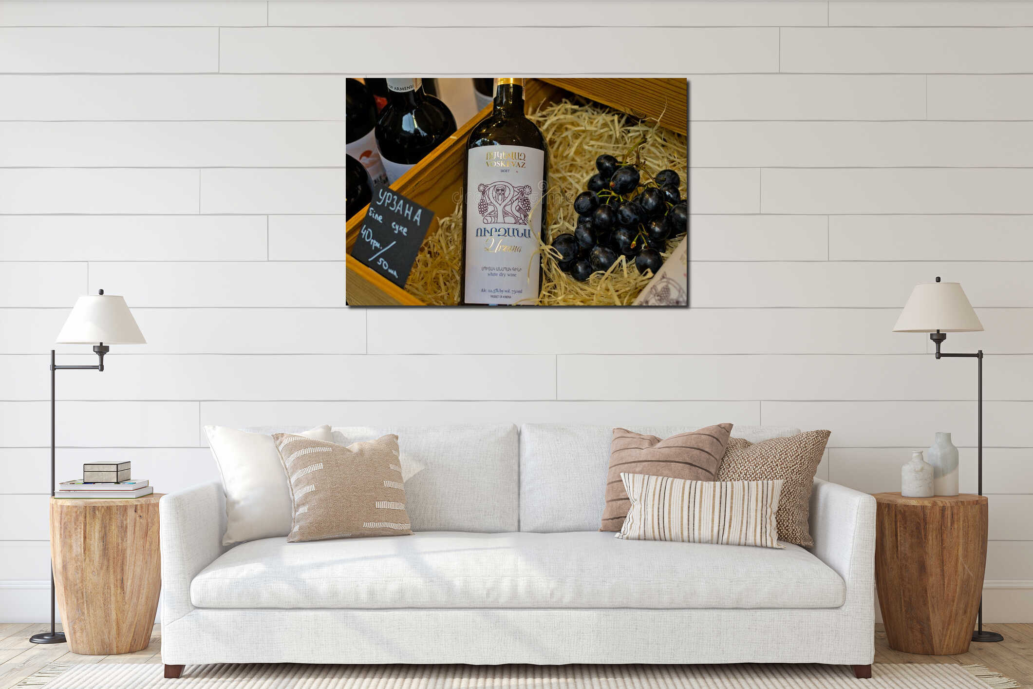 A bottle of expensive elite wine and a bunch of dark grapes in a wooden box with shavings. interior mockup